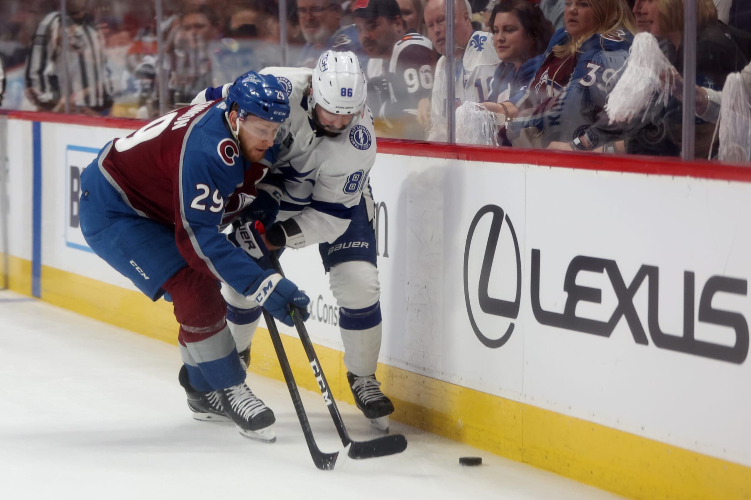 Colorado Avalanche center Nathan MacKinnon (left) and Tampa Bay Lightning winger Nikita Kucherov. 