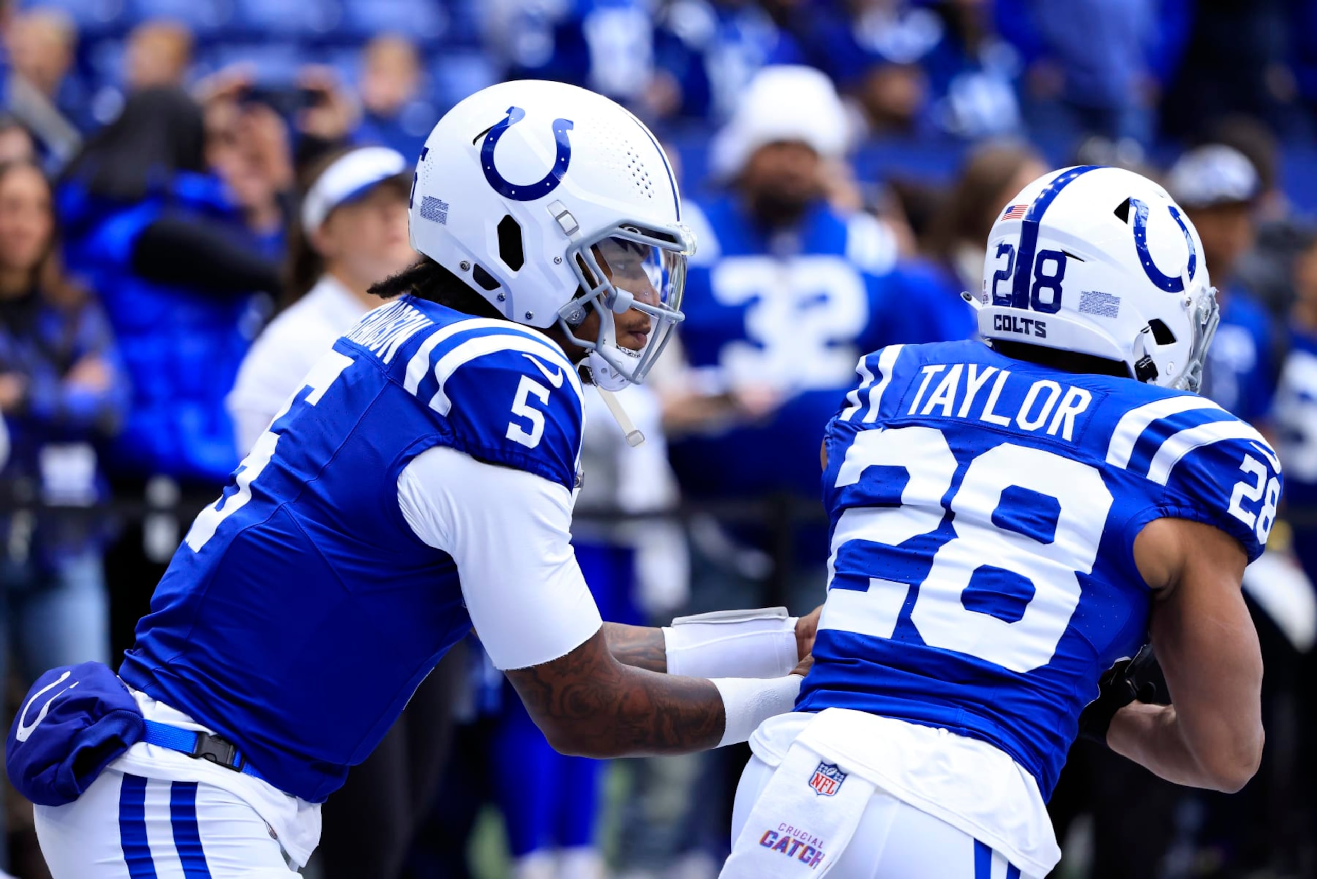 INDIANAPOLIS, INDIANA - OCTOBER 08: Jonathan Taylor #28 and Anthony Richardson #5 of the Indianapolis Colts warm up prior to the game against the Tennessee Titans at Lucas Oil Stadium on October 08, 2023 in Indianapolis, Indiana. (Photo by Justin Casterline/Getty Images)