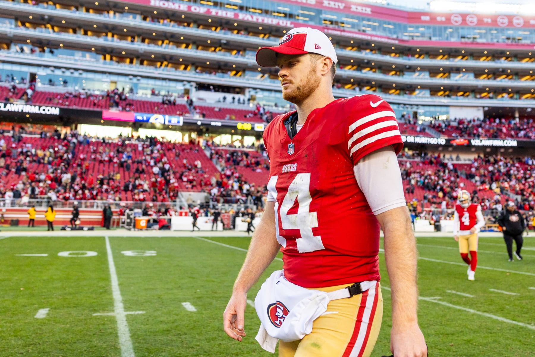 SANTA CLARA, CA - JANUARY 07: San Francisco 49ers quarterback Sam Darnold (14) walks off the field after the NFL professional football game between the Los Angeles Rams and San Francisco 49ers on January 7, 2024 at Lev's Stadium in Santa Clara, CA. (Photo by Bob Kupbens/Icon Sportswire via Getty Images)