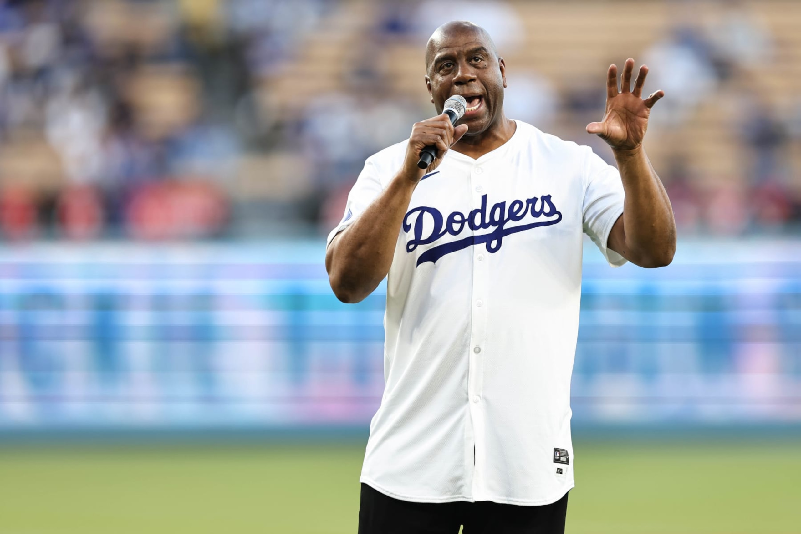 LOS ANGELES, CA - APRIL 15:  Magic Johnson speaks prior to the game between the Washington Nationals and the Los Angeles Dodgers at Dodger Stadium on Monday, April 15, 2024 in Los Angeles, California. (Photo by Michael Owens/MLB Photos via Getty Images)