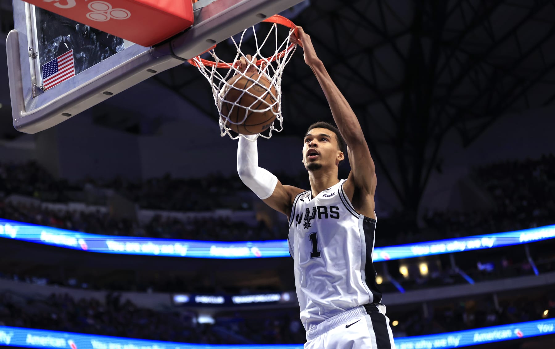 DALLAS, TX - FEBRUARY 14: Victor Wembanyama #1 of the San Antonio Spurs slam dunks against the Dallas Mavericks in the second half at American Airlines Center on February 14, 2024 in Dallas, Texas. NOTE TO USER: User expressly acknowledges and agrees that, by downloading and or using this photograph, User is consenting to the terms and conditions of the Getty Images License Agreement. (Photo by Ron Jenkins/Getty Images)