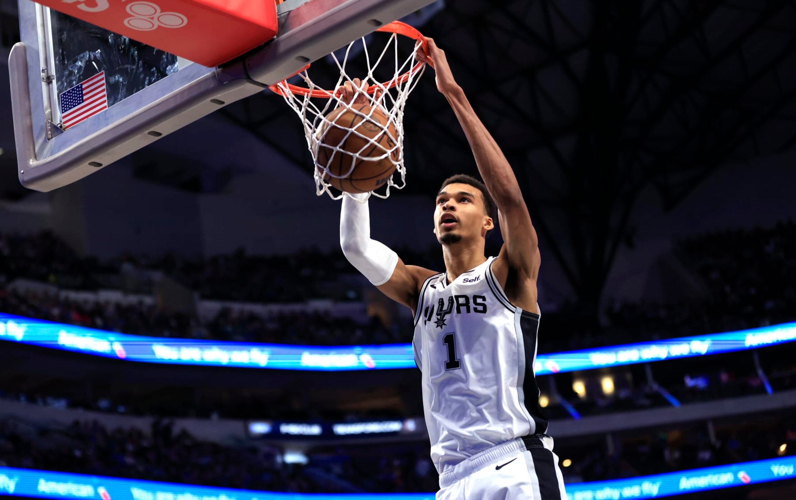 DALLAS, TX - FEBRUARY 14: Victor Wembanyama #1 of the San Antonio Spurs slam dunks against the Dallas Mavericks in the second half at American Airlines Center on February 14, 2024 in Dallas, Texas. NOTE TO USER: User expressly acknowledges and agrees that, by downloading and or using this photograph, User is consenting to the terms and conditions of the Getty Images License Agreement. (Photo by Ron Jenkins/Getty Images)