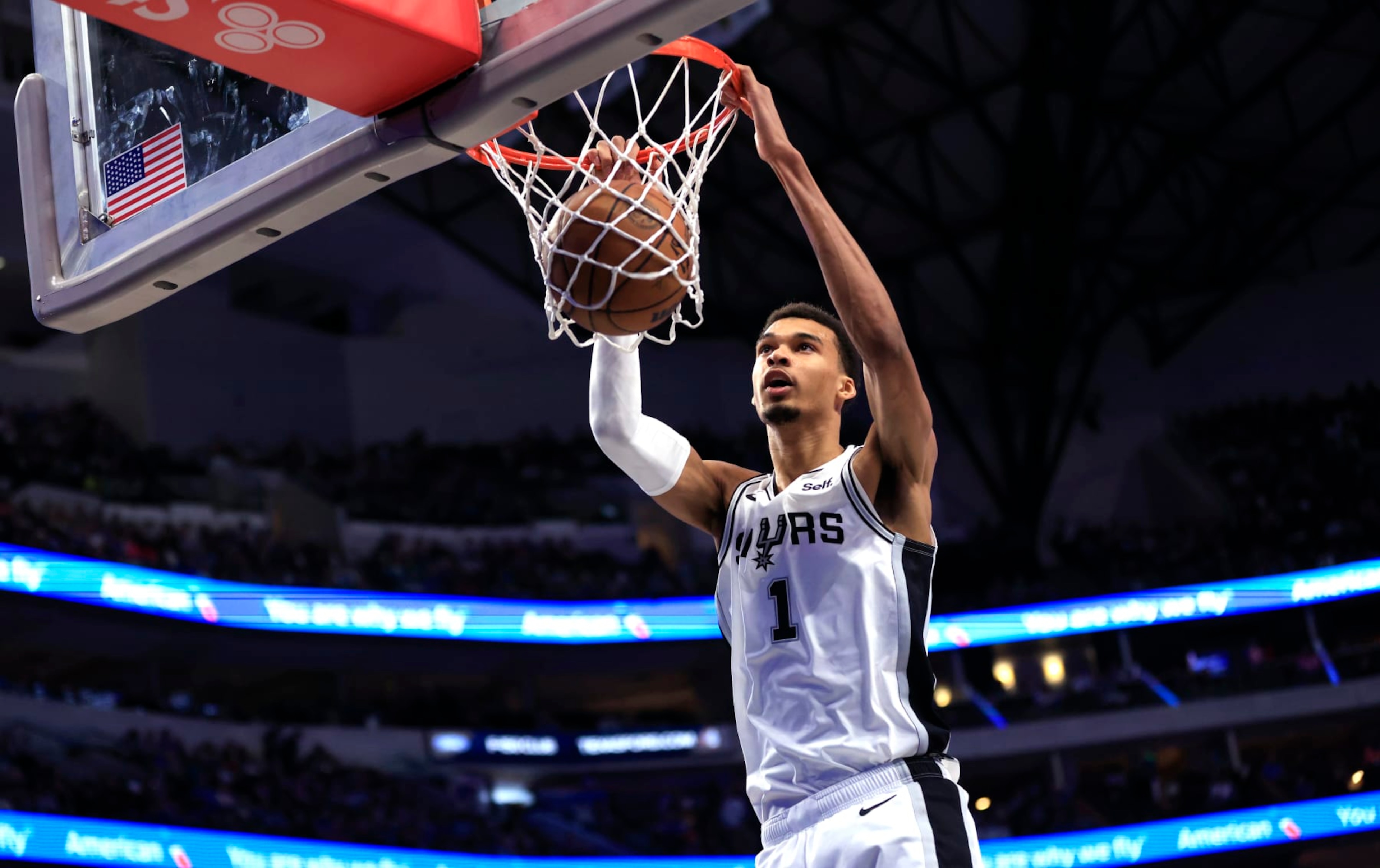 DALLAS, TX - FEBRUARY 14: Victor Wembanyama #1 of the San Antonio Spurs slam dunks against the Dallas Mavericks in the second half at American Airlines Center on February 14, 2024 in Dallas, Texas. NOTE TO USER: User expressly acknowledges and agrees that, by downloading and or using this photograph, User is consenting to the terms and conditions of the Getty Images License Agreement. (Photo by Ron Jenkins/Getty Images)