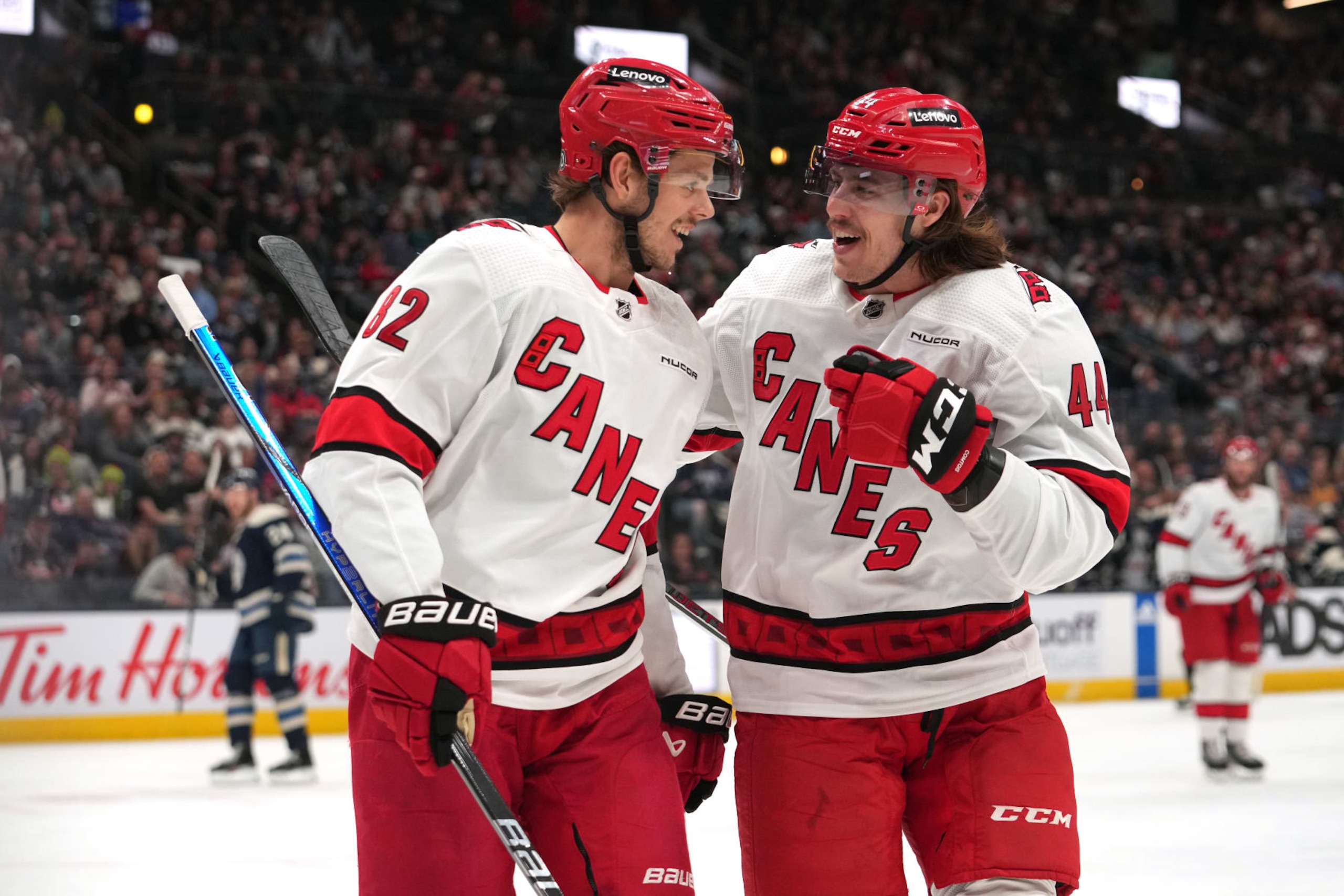 COLUMBUS, OHIO - APRIL 16: Jesperi Kotkaniemi #82 and Maxime Comtois #44 of the Carolina Hurricanes celebrate a goal in the first period against the Columbus Blue Jackets at Nationwide Arena on April 16, 2024 in Columbus, Ohio. (Photo by Jason Mowry/Getty Images)