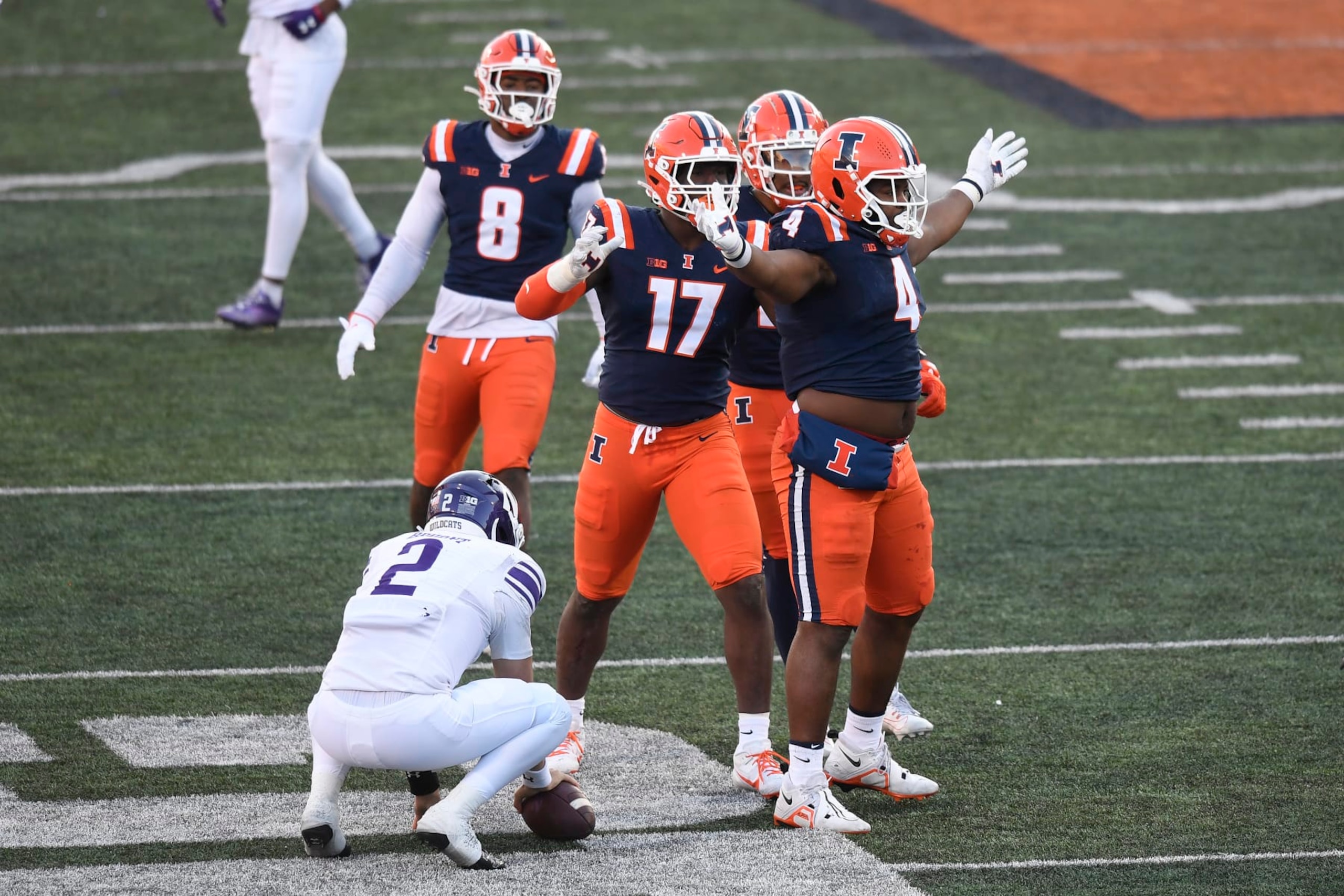 CHAMPAIGN, IL - NOVEMBER 25: Illinois Fighting Illini Defensive Tackle Jer'Zhan Newton (4) reacts after sacking Northwestern Wildcats Quarterback Ben Bryant (2) during the college football game between the Northwestern Wildcats and the Illinois Fighting Illini on November 25, 2023, at Memorial Stadium in Champaign, Illinois. (Photo by Michael Allio/Icon Sportswire via Getty Images) CHAMPAIGN, IL - NOVEMBER 25: Illinois Fighting Illini Defensive Tackle Jer'Zhan Newton (4) reacts after sacking Northwestern Wildcats Quarterback Ben Bryant (2) during the college football game between the Northwestern Wildcats and the Illinois Fighting Illini on November 25, 2023, at Memorial Stadium in Champaign, Illinois. (Photo by Michael Allio/Icon Sportswire via Getty Images)