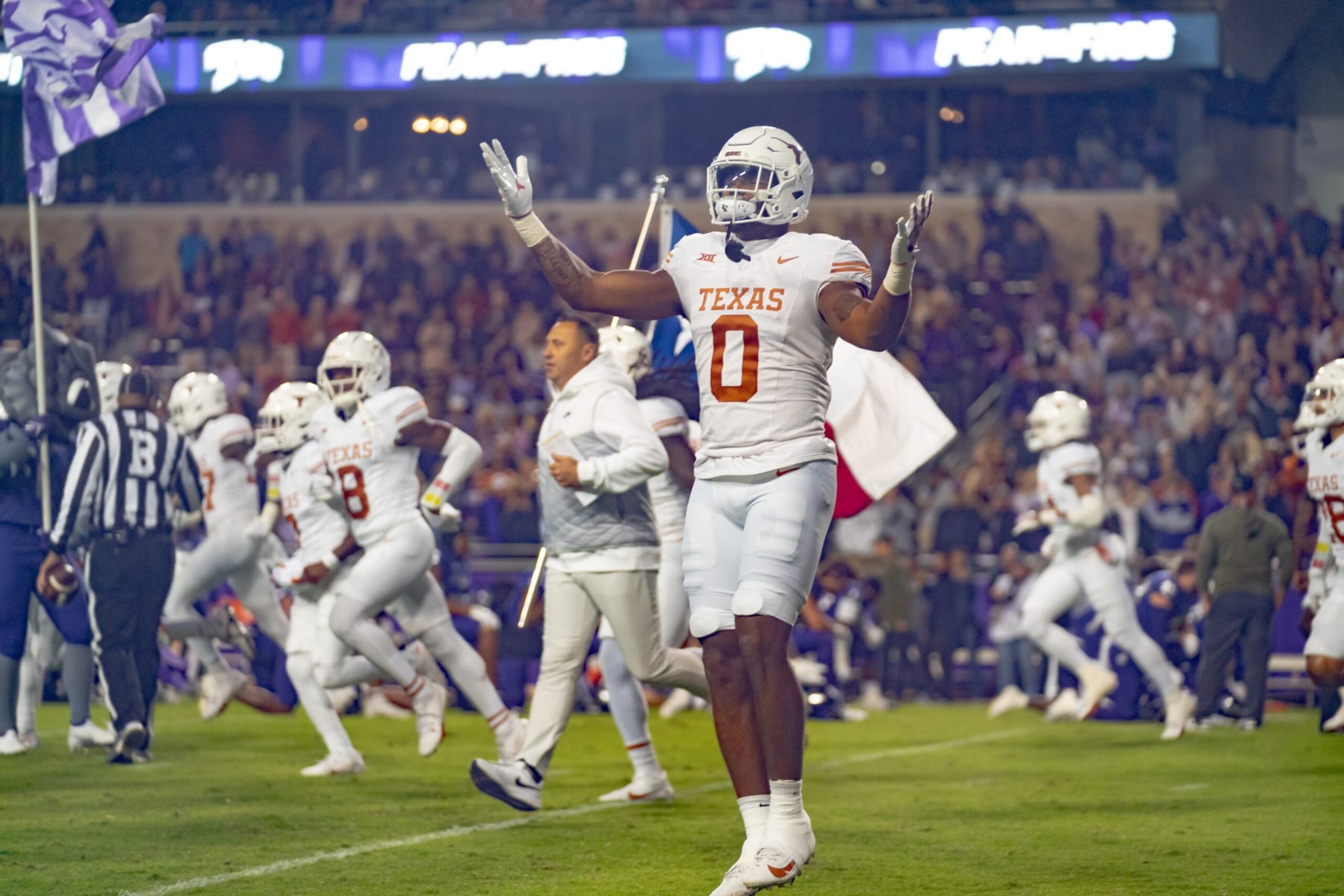 FORT WORTH, TX - NOVEMBER 11:Texas Longhorns tight end Ja'Tavion Sanders (0) runs onto the field before a game between the Texas Longhorns and TCU Horned Frogs college football game on November 11, 2023 at Amon G. Carter Stadium in Fort Worth, TX. (Photo by Chris Leduc/Icon Sportswire via Getty Images)
