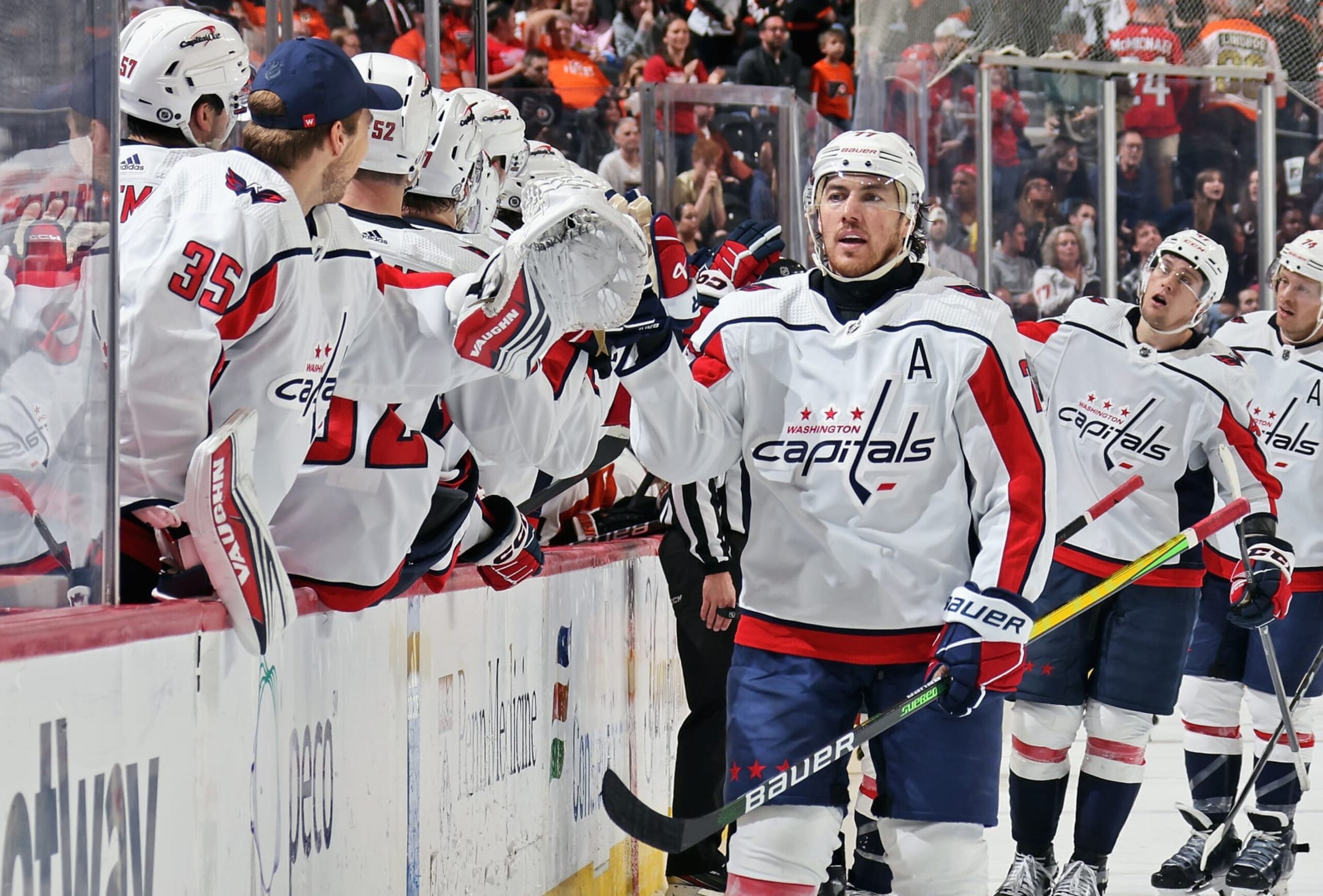 PHILADELPHIA, PENNSYLVANIA - APRIL 16: T.J. Oshie #77 of the Washington Capitals celebrates his third period empty-net goal against the Philadelphia Flyers with his teammates on the bench at the Wells Fargo Center on April 16, 2024 in Philadelphia, Pennsylvania. With tonight's win, the Capitals have reached the NHL playoffs. (Photo by Len Redkoles/NHLI via Getty Images)