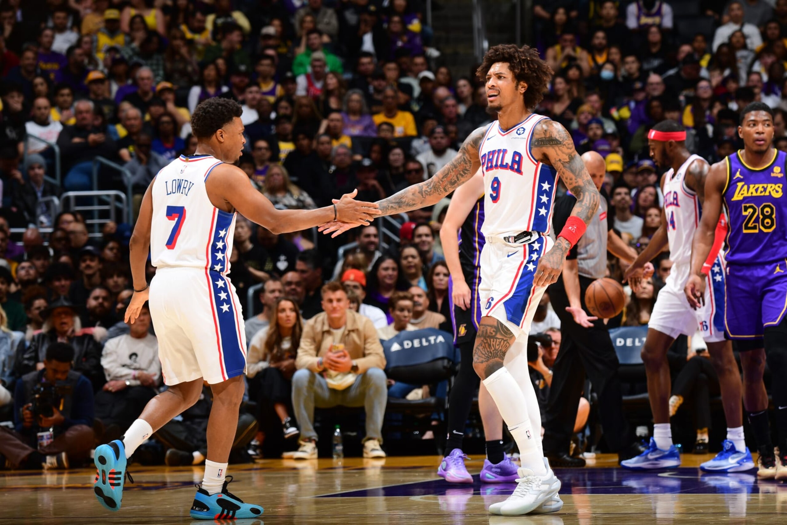 LOS ANGELES, CA - MARCH 22: Kelly Oubre Jr. #9 and Kyle Lowry #7 of the Philadelphia 76ers high five during the game against the Los Angeles Lakers on March 22, 2024 at Crypto.Com Arena in Los Angeles, California. NOTE TO USER: User expressly acknowledges and agrees that, by downloading and/or using this Photograph, user is consenting to the terms and conditions of the Getty Images License Agreement. Mandatory Copyright Notice: Copyright 2024 NBAE (Photo by Adam Pantozzi/NBAE via Getty Images)