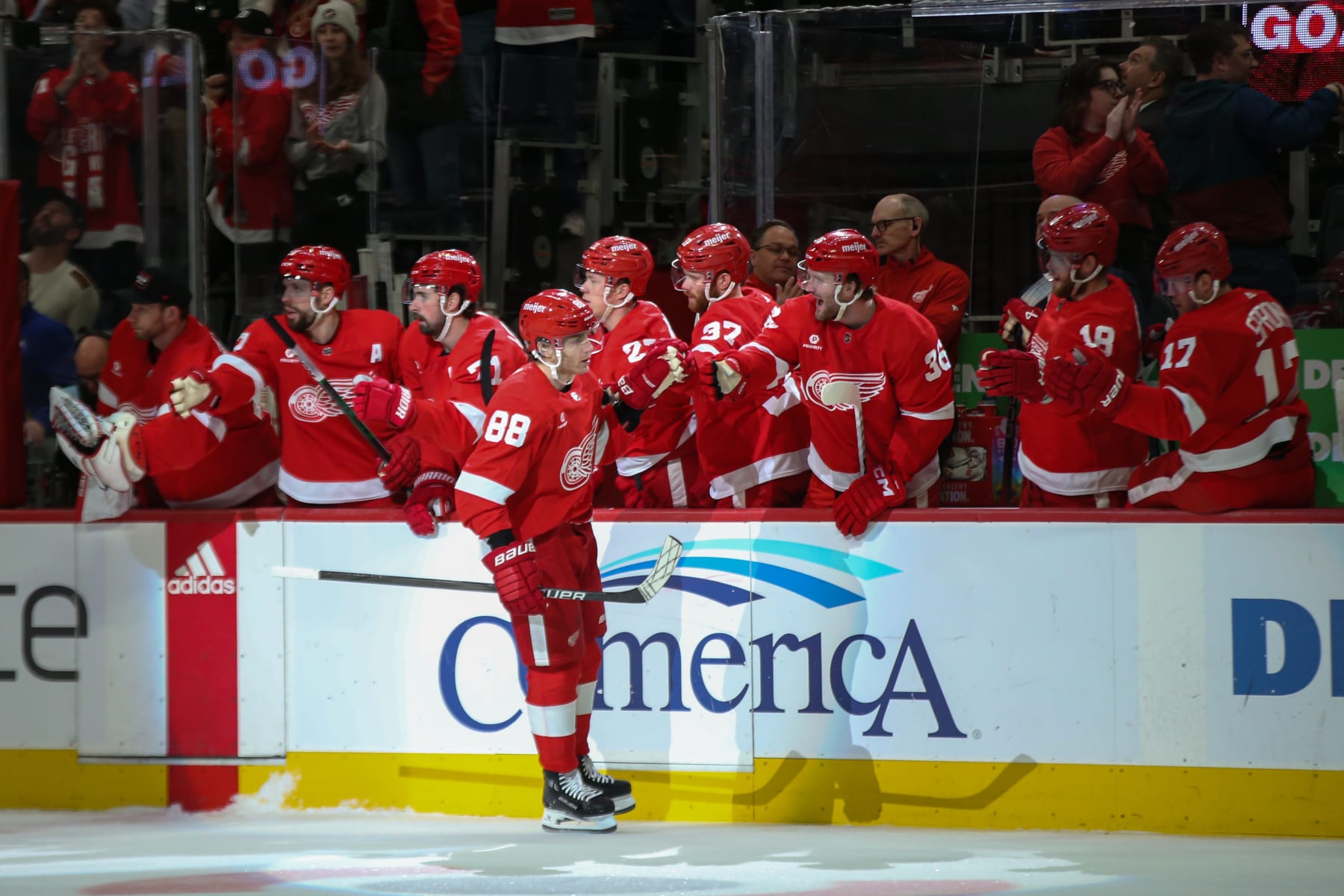 DETROIT, MI - APRIL 07:  Detroit Red Wings forward Patrick Kane (88) celebrates scoring a goal with his teammates during the first period of an NHL regular season hockey game between the Buffalo Sabres and the Detroit Red Wings on April 7, 2024 at Little Caesars Arena in Detroit, Michigan. (Photo by Scott W. Grau/Icon Sportswire via Getty Images)
