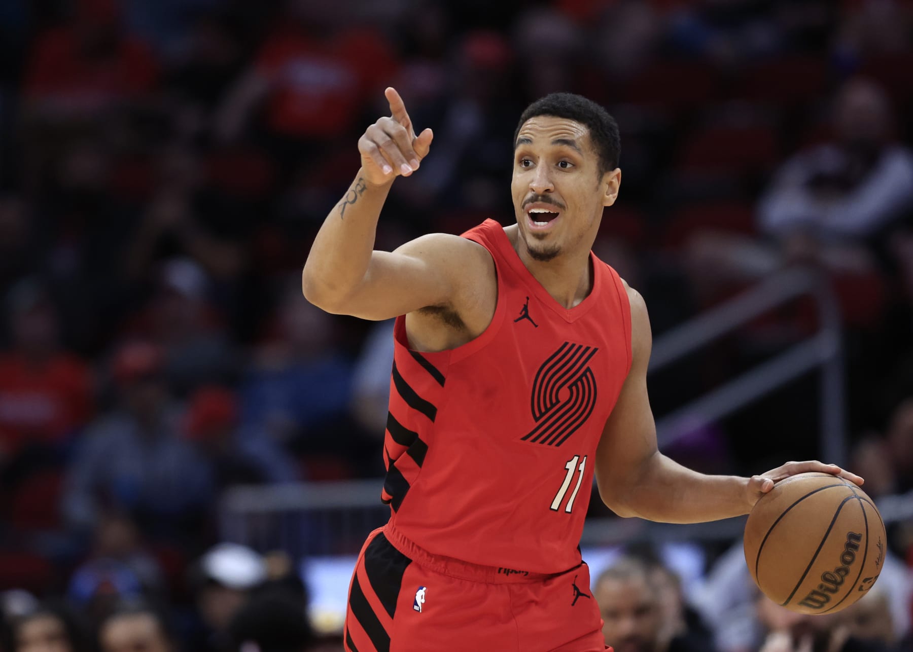 HOUSTON, TEXAS - JANUARY 24: Malcolm Brogdon #11 of the Portland Trail Blazers in action against the Houston Rockets during the first half at Toyota Center on January 24, 2024 in Houston, Texas. (Photo by Carmen Mandato/Getty Images)