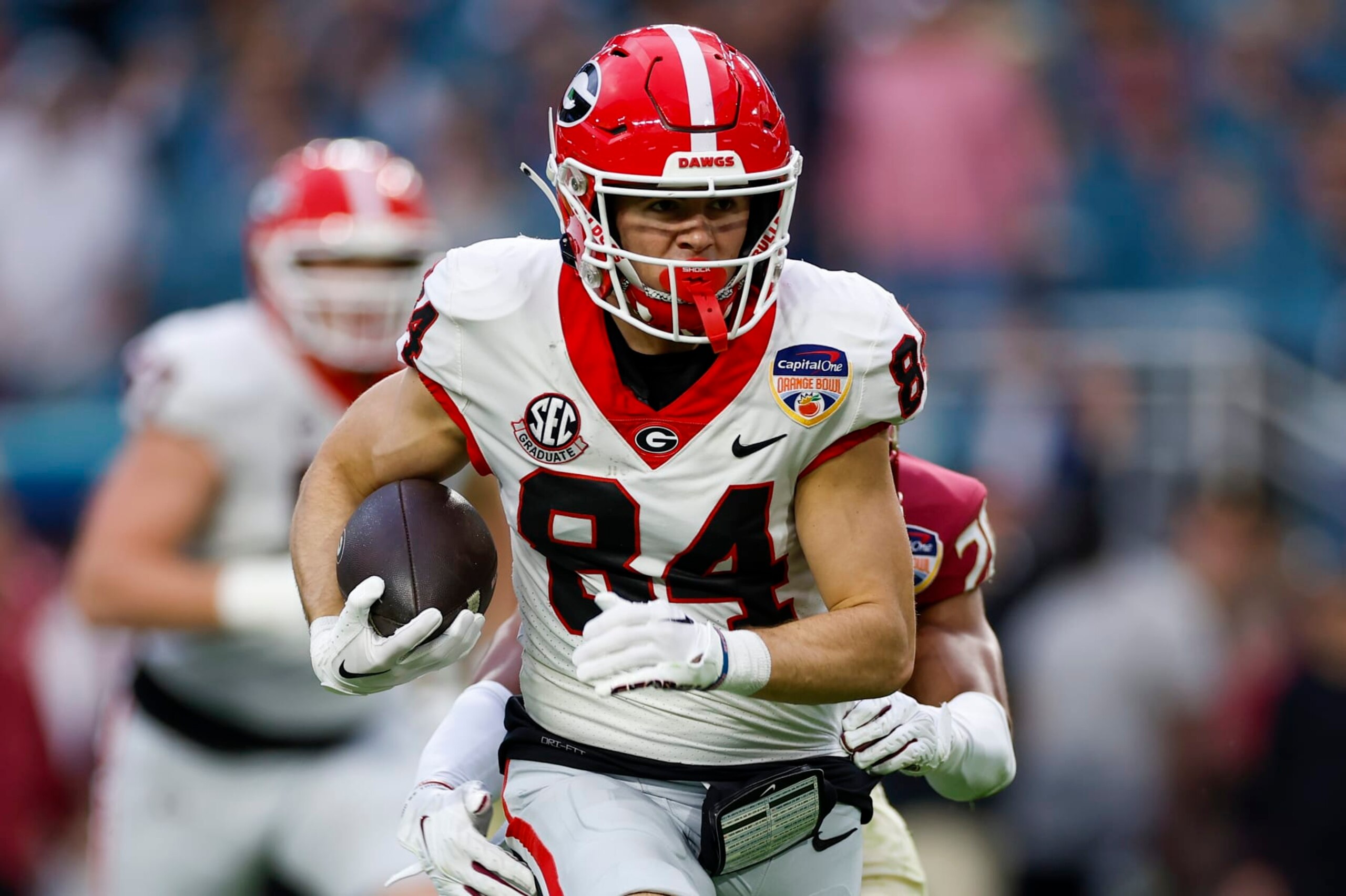 MIAMI GARDENS, FL - DECEMBER 30: Georgia Bulldogs wide receiver Ladd McConkey (84) runs with the ball after a catch during the game between the Georgia Bulldogs and the Florida State Seminoles on December 30, 2023 at Hard Rock Stadium in Miami Gardens, Fl.  (Photo by David Rosenblum/Icon Sportswire via Getty Images)