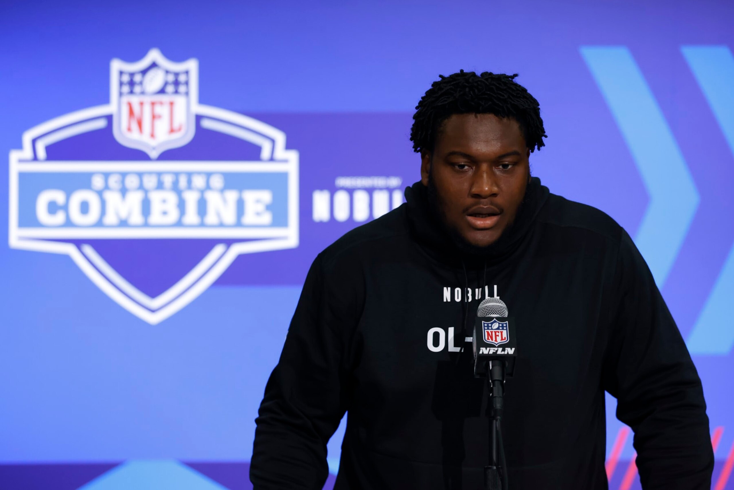 INDIANAPOLIS, INDIANA - MARCH 02: Christian Haynes #OL33 of the Connecticut speaks to the media during the 2024 NFL Combine at the Indiana Convention Center on March 02, 2024 in Indianapolis, Indiana. (Photo by Justin Casterline/Getty Images)
