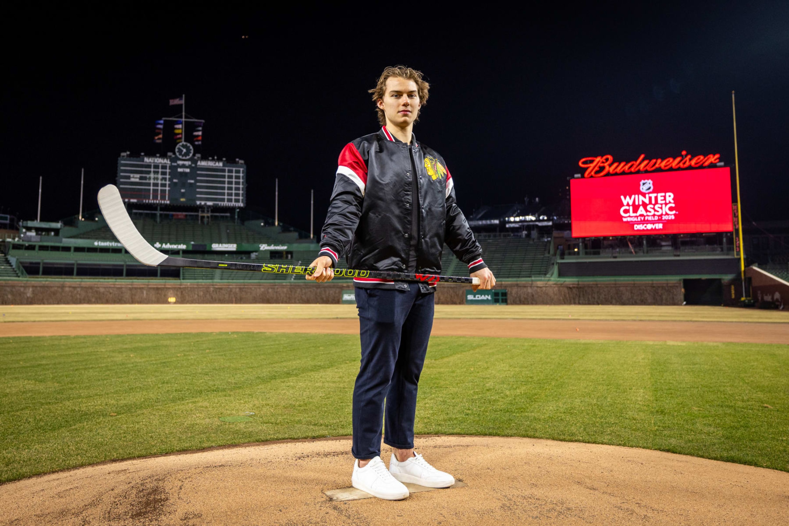 CHICAGO, ILLINOIS - FEBRUARY 07: Connor Bedard #98 of the Chicago Blackhawks poses for a portrait after announcing that the 2025 Discover NHL Winter Classic will feature the Chicago Blackhawks hosting the St. Louis Blues at Wrigley Field on February 07, 2024 in Chicago, Illinois. (Photo by Chase Agnello-Dean/NHLI via Getty Images) CHICAGO, ILLINOIS - FEBRUARY 07: Connor Bedard #98 of the Chicago Blackhawks poses for a portrait after announcing that the 2025 Discover NHL Winter Classic will feature the Chicago Blackhawks hosting the St. Louis Blues at Wrigley Field on February 07, 2024 in Chicago, Illinois. (Photo by Chase Agnello-Dean/NHLI via Getty Images)