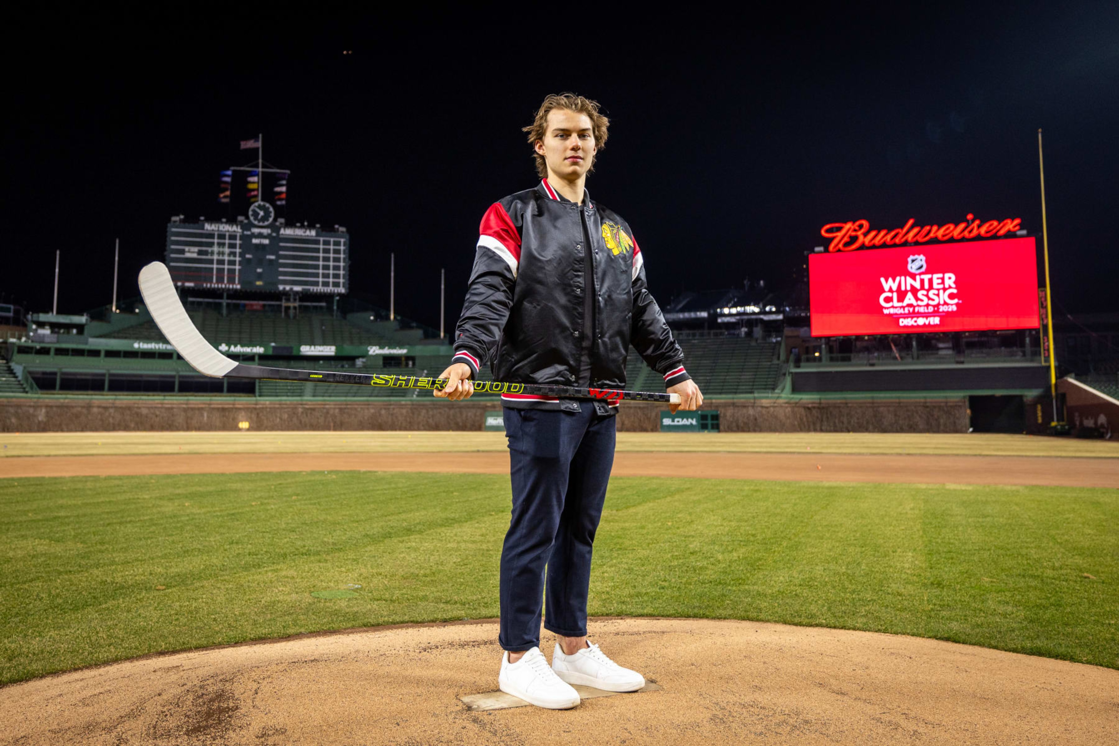 CHICAGO, ILLINOIS - FEBRUARY 07: Connor Bedard #98 of the Chicago Blackhawks poses for a portrait after announcing that the 2025 Discover NHL Winter Classic will feature the Chicago Blackhawks hosting the St. Louis Blues at Wrigley Field on February 07, 2024 in Chicago, Illinois. (Photo by Chase Agnello-Dean/NHLI via Getty Images)