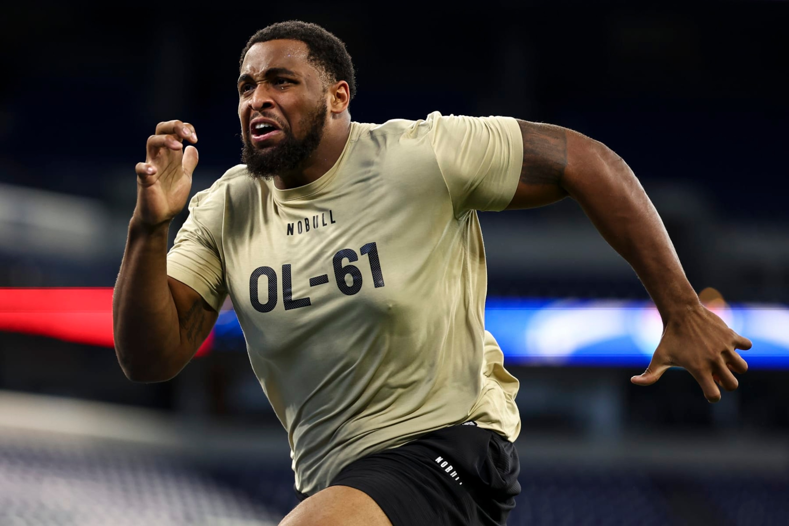 INDIANAPOLIS, INDIANA - MARCH 3: Layden Robinson #OL61 of Texas A&M participates in a drill during the NFL Combine at the Lucas Oil Stadium on March 3, 2024 in Indianapolis, Indiana. (Photo by Kevin Sabitus/Getty Images)
