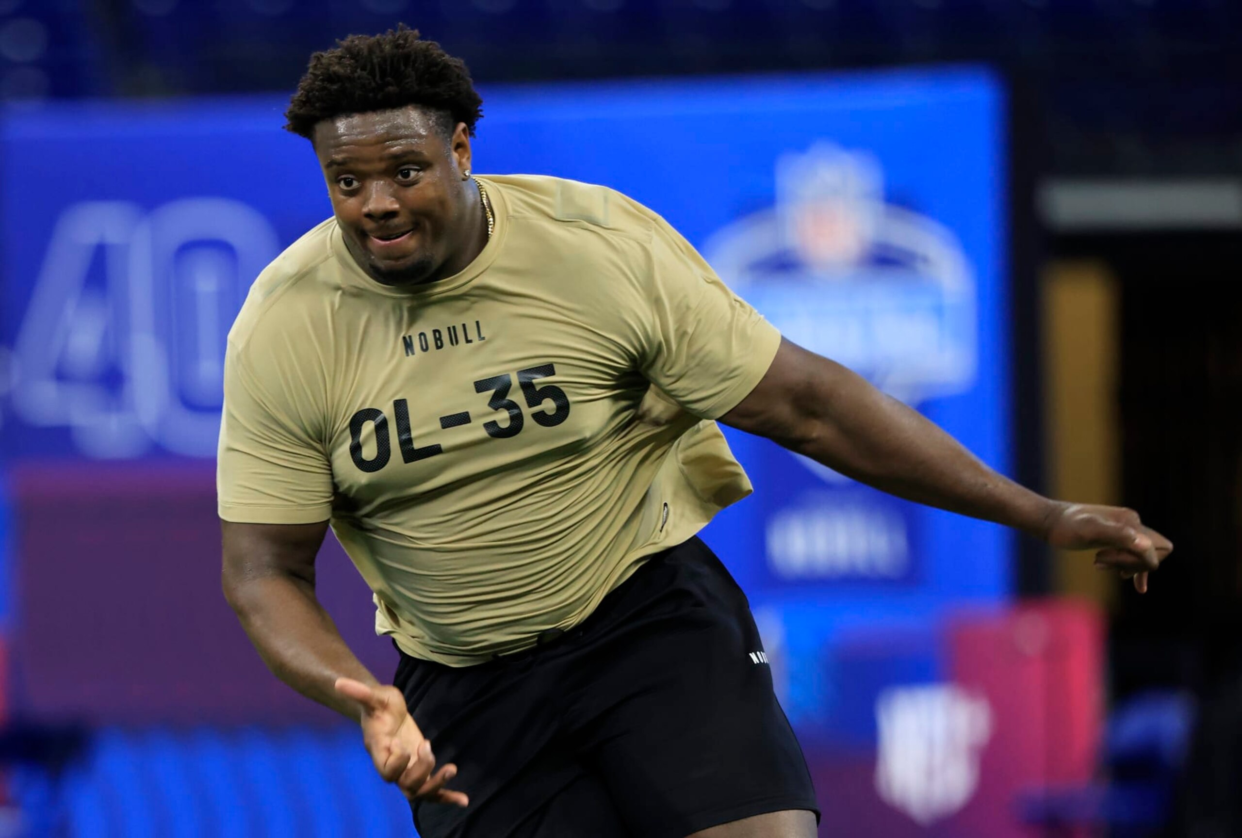 INDIANAPOLIS, INDIANA - MARCH 03: Christian Jones #OL35 of the Texas  participates in a drill during the NFL Combine at Lucas Oil Stadium on March 03, 2024 in Indianapolis, Indiana. (Photo by Justin Casterline/Getty Images)