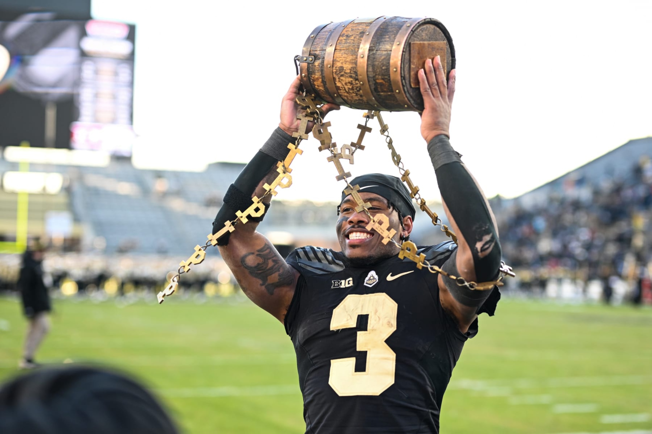 WEST LAFAYETTE, IN - NOVEMBER 25: Purdue RB Tyrone Tracy Jr. (3) celebrates with the Old Oaken Bucket following a college football game between the Indiana Hoosiers and Purdue Boilermakers on November 25, 2023 at Ross-Ade Stadium in West Lafayette, IN. (Photo by James Black/Icon Sportswire via Getty Images)