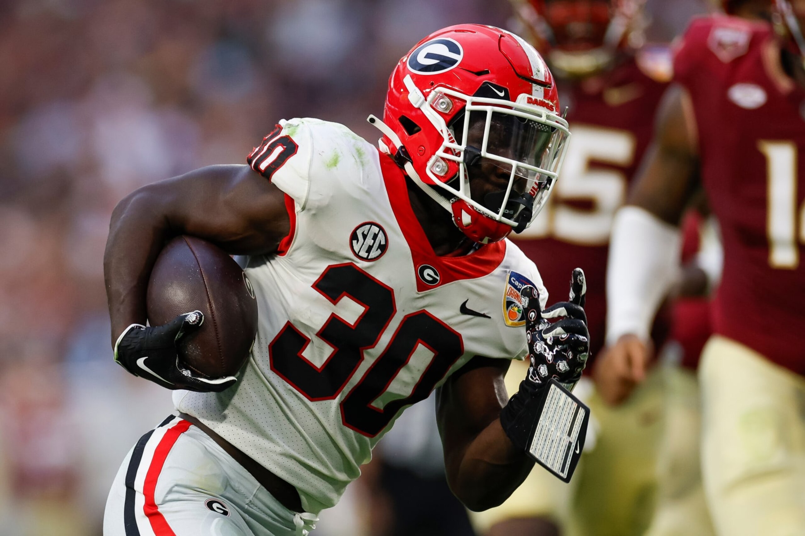 MIAMI GARDENS, FLORIDA - DECEMBER 30: Daijun Edwards #30 of the Georgia Bulldogs runs with the ball during the Capital One Orange Bowl game against the Florida State Seminoles at Hard Rock Stadium on December 30, 2023 in Miami Gardens, Florida. (Photo by Brandon Sloter/Image Of Sport/Getty Images)