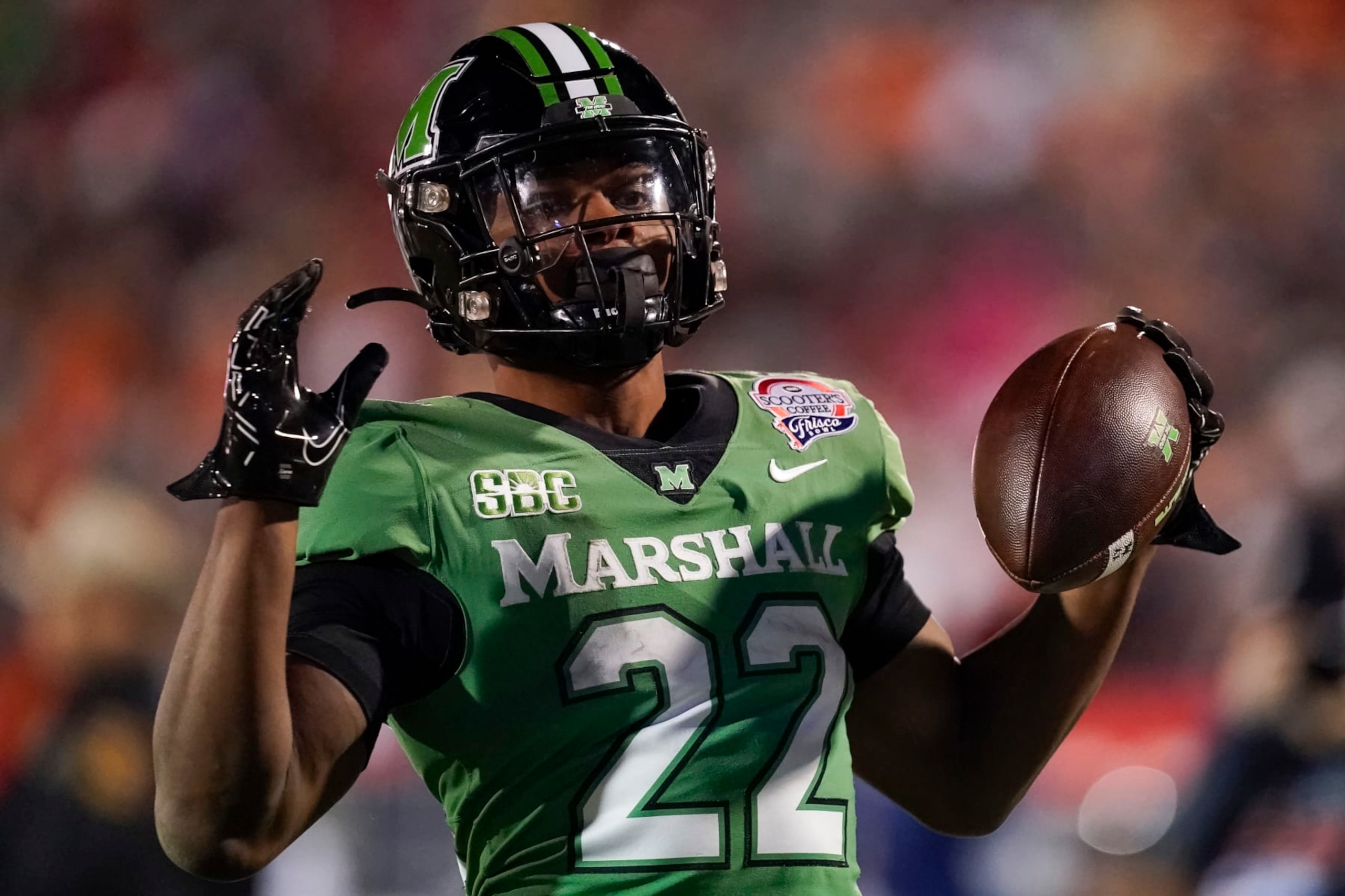 FRISCO, TEXAS - DECEMBER 19: Rasheen Ali #22 of the Marshall Thundering Herd holds the ball after running into the endzone for a touchdown during the first half of the Frisco Bowl against the UTSA Roadrunners at Toyota Stadium on December 19, 2023 in Frisco, Texas. (Photo by Sam Hodde/Getty Images)