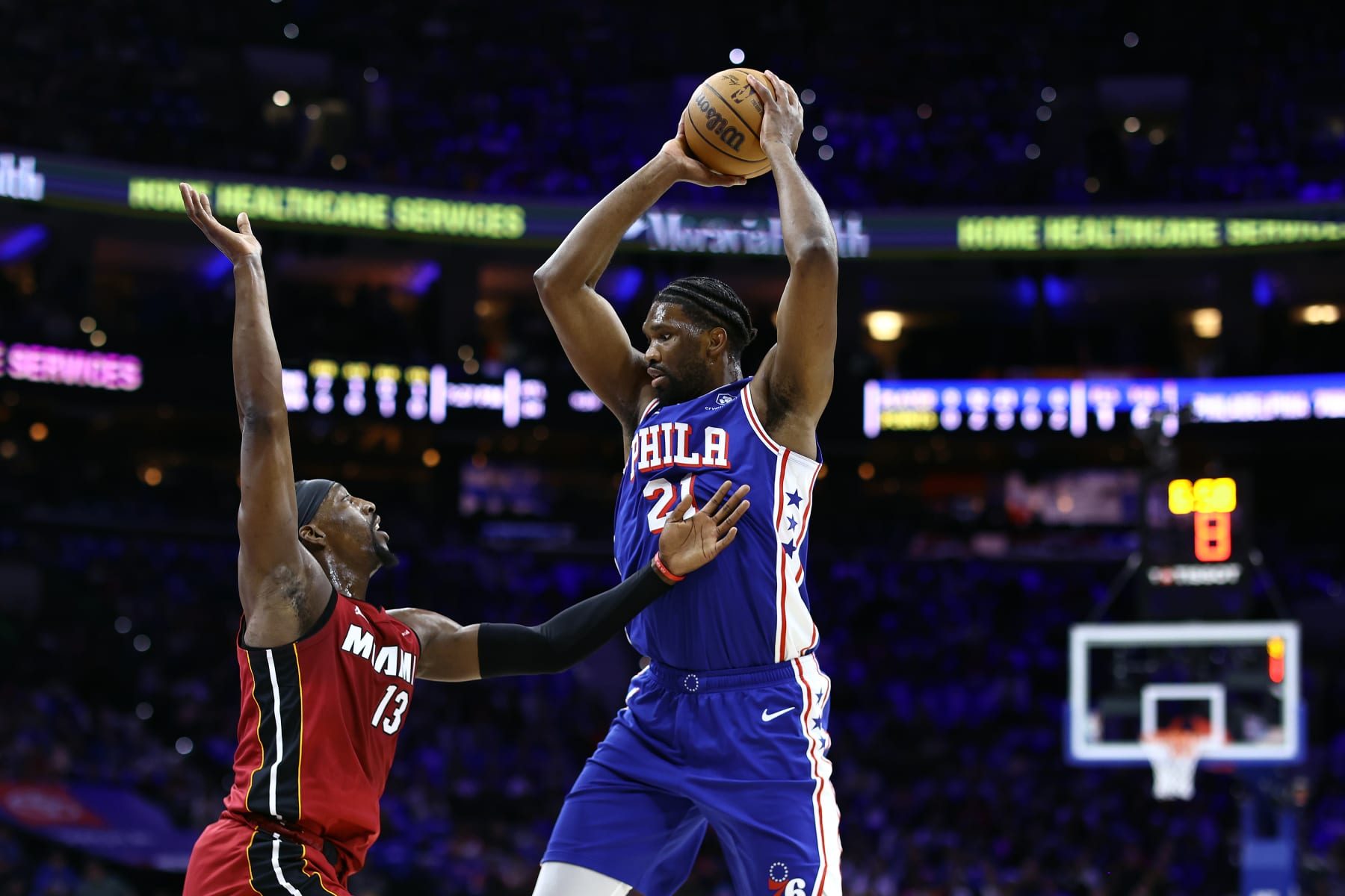 PHILADELPHIA, PENNSYLVANIA - APRIL 17: Bam Adebayo #13 of the Miami Heat guards Joel Embiid #21 of the Philadelphia 76ers during the first quarter of the Eastern Conference Play-In Tournament at the Wells Fargo Center on April 17, 2024 in Philadelphia, Pennsylvania. NOTE TO USER: User expressly acknowledges and agrees that, by downloading and or using this photograph, User is consenting to the terms and conditions of the Getty Images License Agreement. (Photo by Tim Nwachukwu/Getty Images)