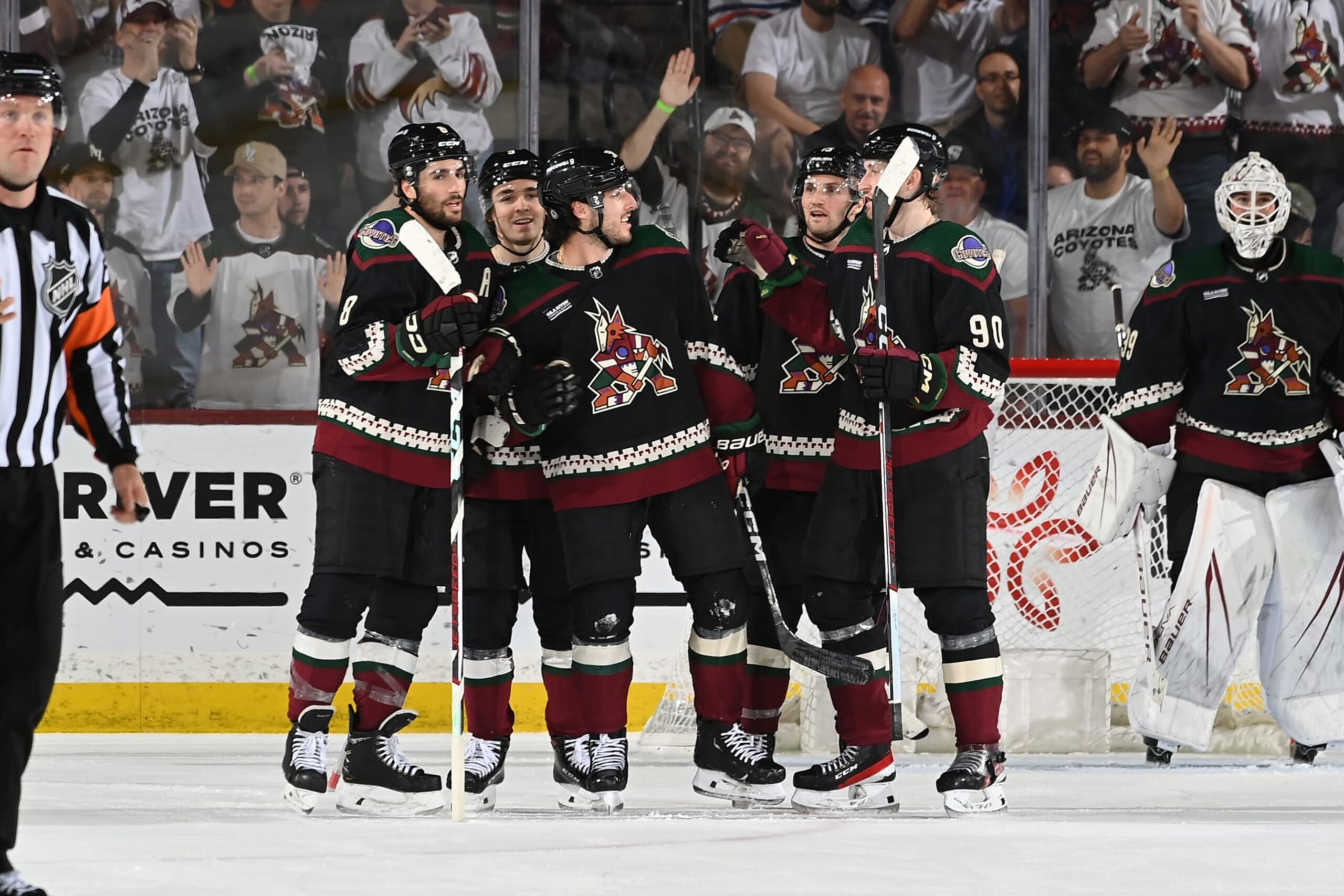 TEMPE, ARIZONA - APRIL 17: Sean Durzi #50 of the Arizona Coyotes celebrates with Nick Schmaltz #8, JJ Moser #90 and teammates after scoring a goal against the Edmonton Oilers during the third period of the game at Mullett Arena on April 17, 2024 in Tempe, Arizona. (Photo by Norm Hall/NHLI via Getty Images) TEMPE, ARIZONA - APRIL 17: Sean Durzi #50 of the Arizona Coyotes celebrates with Nick Schmaltz #8, JJ Moser #90 and teammates after scoring a goal against the Edmonton Oilers during the third period of the game at Mullett Arena on April 17, 2024 in Tempe, Arizona. (Photo by Norm Hall/NHLI via Getty Images)