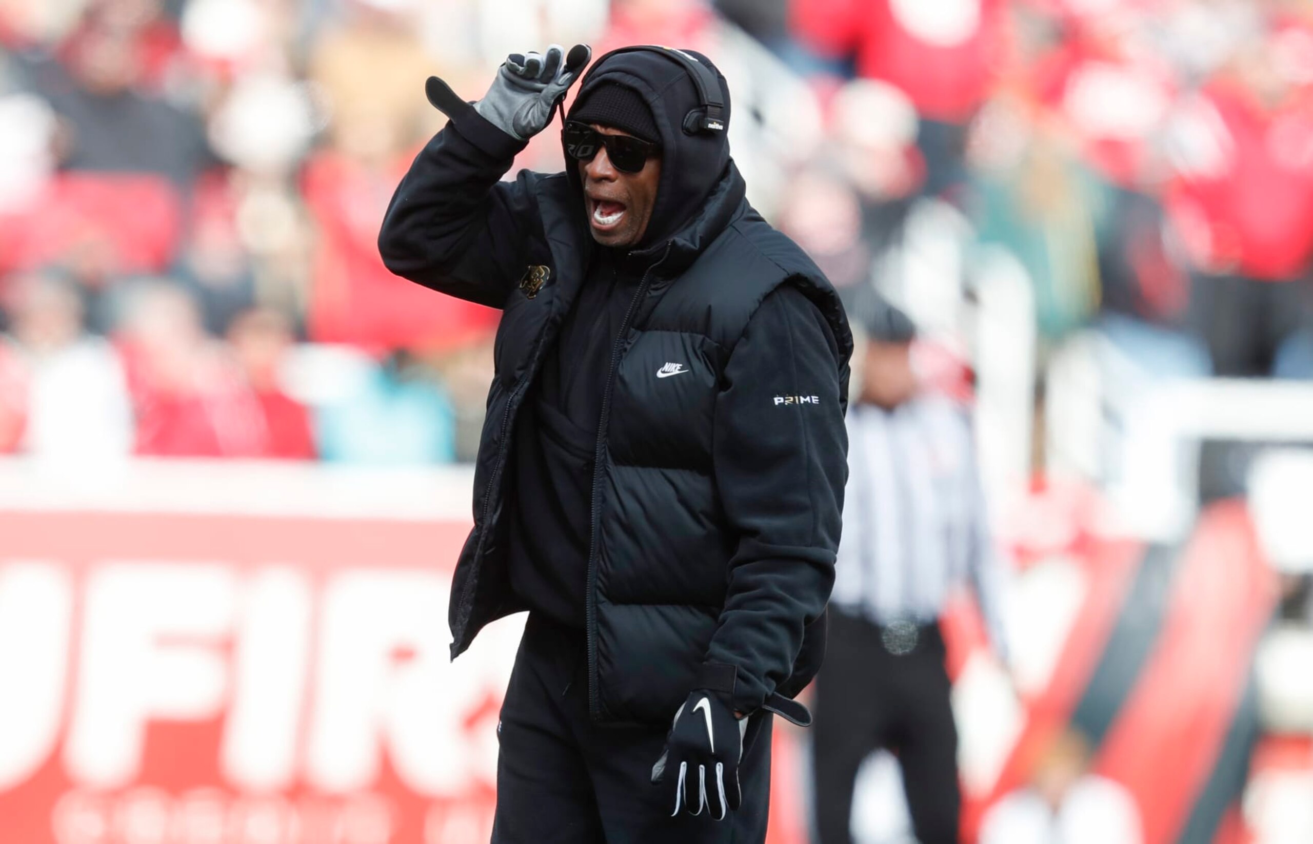 SALT LAKE CITY, UT - NOVEMBER 25:  Deion Sanders head coach of the Colorado Buffaloes calls a play during the first half of their game aginast the Utah Utes at Rice Eccles Stadium on November 25, 2023 in Salt Lake City, Utah.  (Photo by Chris Gardner/Getty Images)