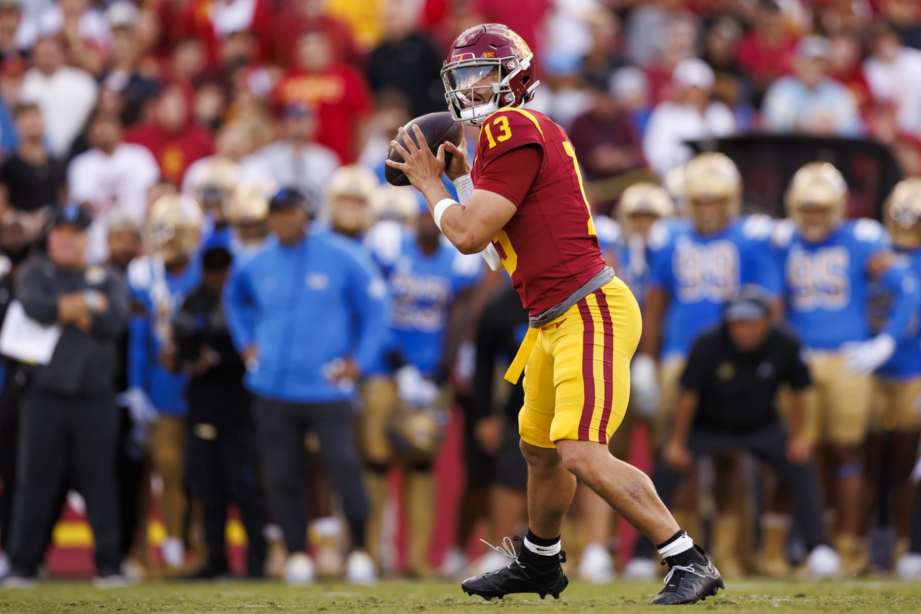 LOS ANGELES, CALIFORNIA - NOVEMBER 18: Caleb Williams #13 of the USC Trojans drops back and looks to throw a pass during the first half of a game against the UCLA Bruins at United Airlines Field at the Los Angeles Memorial Coliseum on November 18, 2023 in Los Angeles, California. (Photo by Ryan Kang/Getty Images)