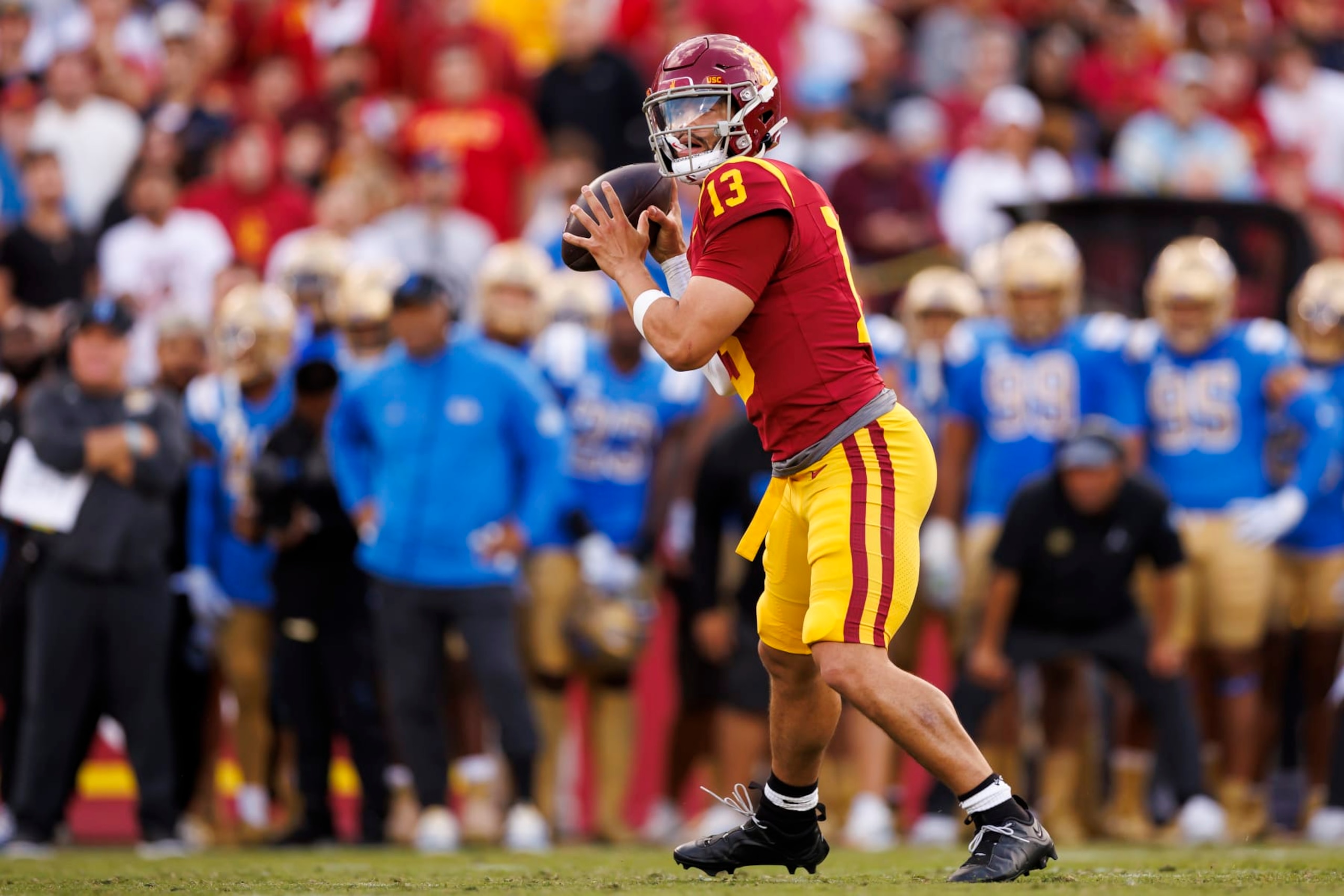 LOS ANGELES, CALIFORNIA - NOVEMBER 18: Caleb Williams #13 of the USC Trojans drops back and looks to throw a pass during the first half of a game against the UCLA Bruins at United Airlines Field at the Los Angeles Memorial Coliseum on November 18, 2023 in Los Angeles, California. (Photo by Ryan Kang/Getty Images) LOS ANGELES, CALIFORNIA - NOVEMBER 18: Caleb Williams #13 of the USC Trojans drops back and looks to throw a pass during the first half of a game against the UCLA Bruins at United Airlines Field at the Los Angeles Memorial Coliseum on November 18, 2023 in Los Angeles, California. (Photo by Ryan Kang/Getty Images)