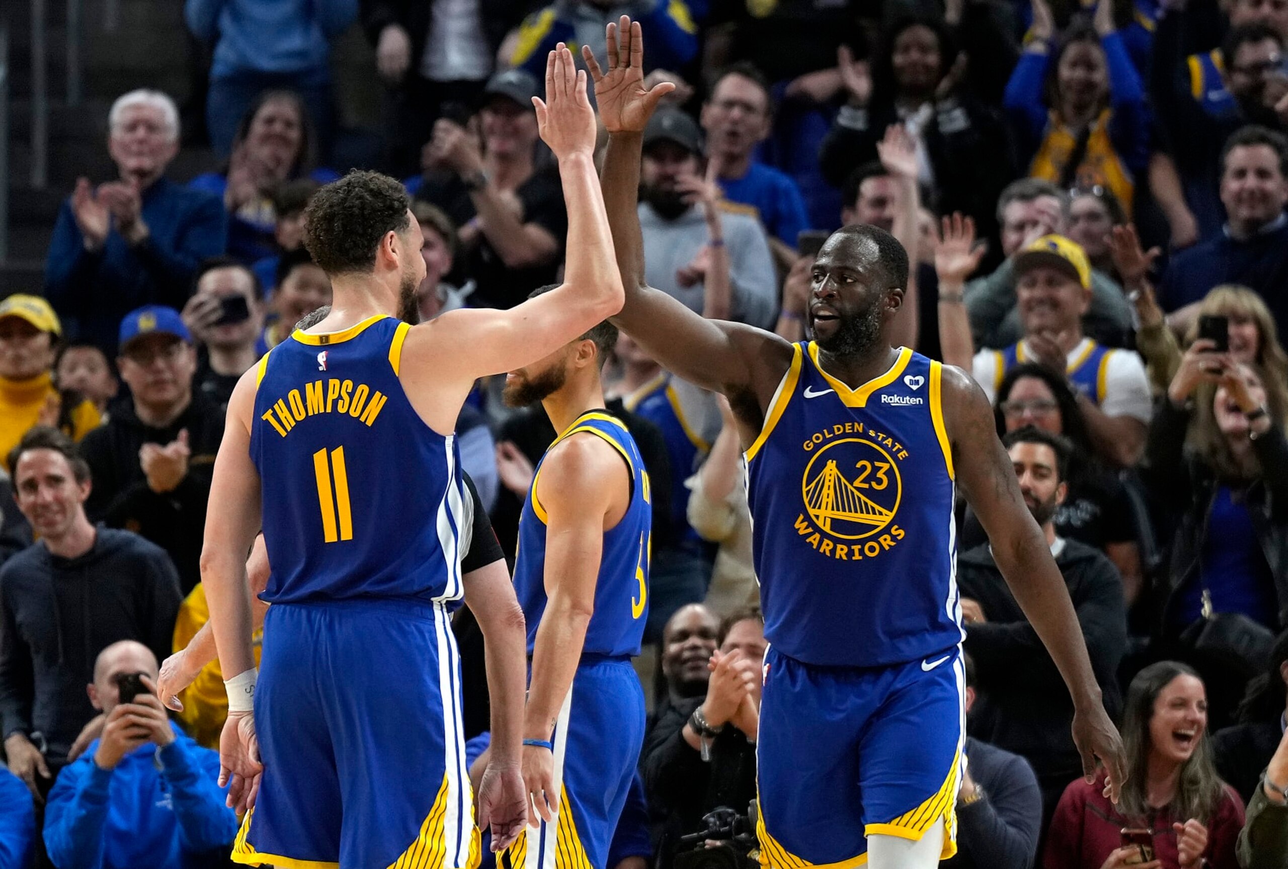 SAN FRANCISCO, CALIFORNIA - APRIL 02: Draymond Green #23 of the Golden State Warriors celebrates with Klay Thompson #11 after scoring against the Dallas Mavericks late in the second half at Chase Center on April 02, 2024 in San Francisco, California. NOTE TO USER: User expressly acknowledges and agrees that, by downloading and or using this photograph, User is consenting to the terms and conditions of the Getty Images License Agreement. (Photo by Thearon W. Henderson/Getty Images)