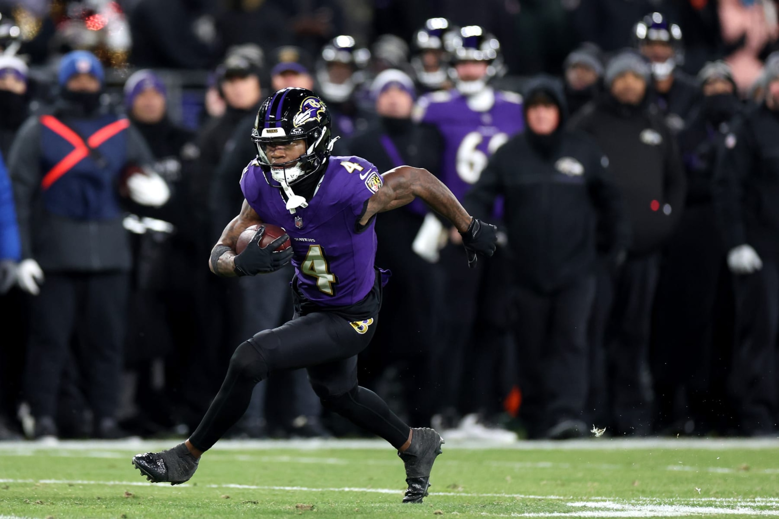 BALTIMORE, MARYLAND - JANUARY 20: Wide receiver Zay Flowers #4 of the Baltimore Ravens runs with the ball after making a second half catch against the Houston Texans during the AFC Divisional Playoff game against the Baltimore Ravens at M&T Bank Stadium on January 20, 2024 in Baltimore, Maryland. (Photo by Rob Carr/Getty Images) BALTIMORE, MARYLAND - JANUARY 20: Wide receiver Zay Flowers #4 of the Baltimore Ravens runs with the ball after making a second half catch against the Houston Texans during the AFC Divisional Playoff game against the Baltimore Ravens at M&T Bank Stadium on January 20, 2024 in Baltimore, Maryland. (Photo by Rob Carr/Getty Images)