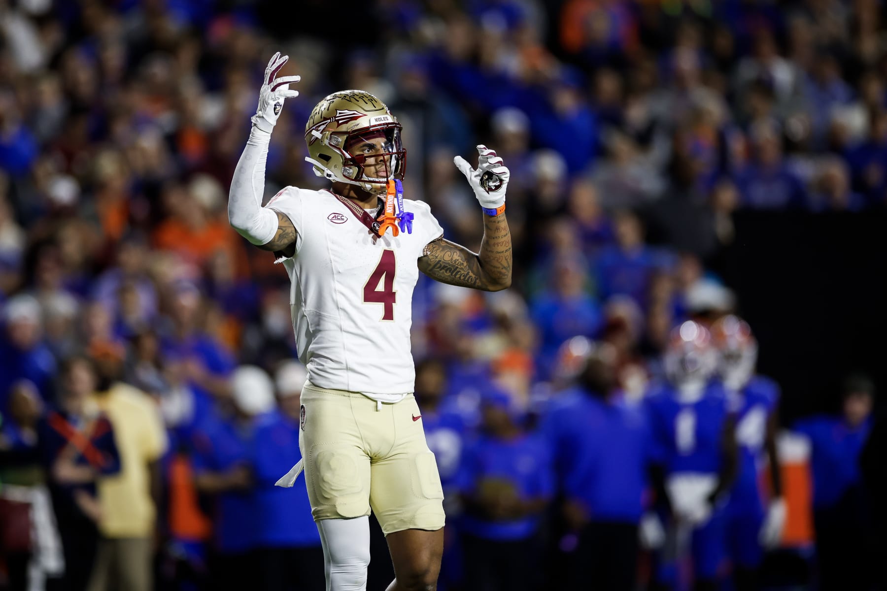 GAINESVILLE, FLORIDA - NOVEMBER 25: Keon Coleman #4 of the Florida State Seminoles looks on during the first half of a game against the Florida Gators at Ben Hill Griffin Stadium on November 25, 2023 in Gainesville, Florida. (Photo by James Gilbert/Getty Images)