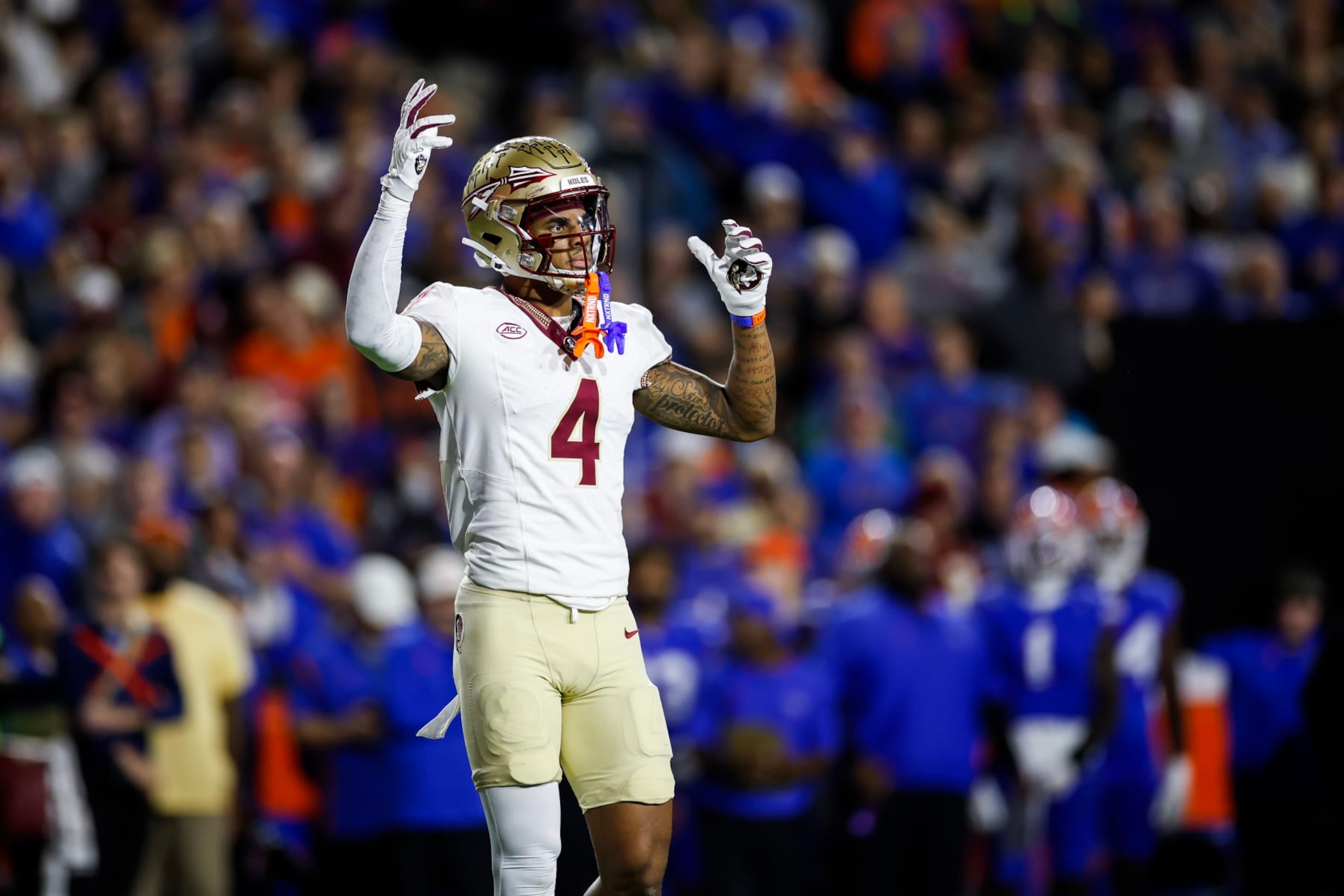 GAINESVILLE, FLORIDA - NOVEMBER 25: Keon Coleman #4 of the Florida State Seminoles looks on during the first half of a game against the Florida Gators at Ben Hill Griffin Stadium on November 25, 2023 in Gainesville, Florida. (Photo by James Gilbert/Getty Images) GAINESVILLE, FLORIDA - NOVEMBER 25: Keon Coleman #4 of the Florida State Seminoles looks on during the first half of a game against the Florida Gators at Ben Hill Griffin Stadium on November 25, 2023 in Gainesville, Florida. (Photo by James Gilbert/Getty Images)