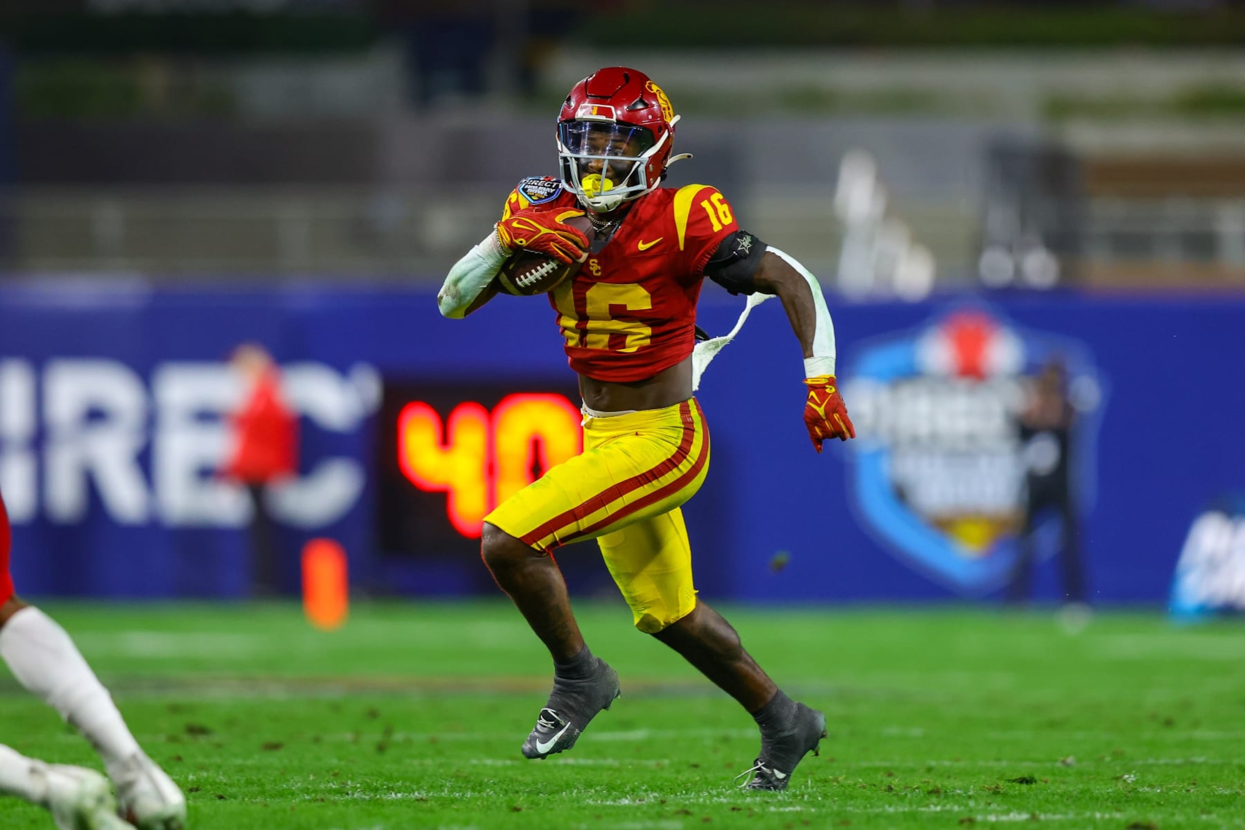 SAN DIEGO, CA - DECEMBER 27: USC Trojans wide receiver Tahj Washington (16) catches the ball for a gain during the Directv Holiday Bowl football game between the Louisville Cardinals and the USC Trojans on December 27, 2023, at Petco Park in San Diego, CA. (Photo by Jordon Kelly/Icon Sportswire via Getty Images)