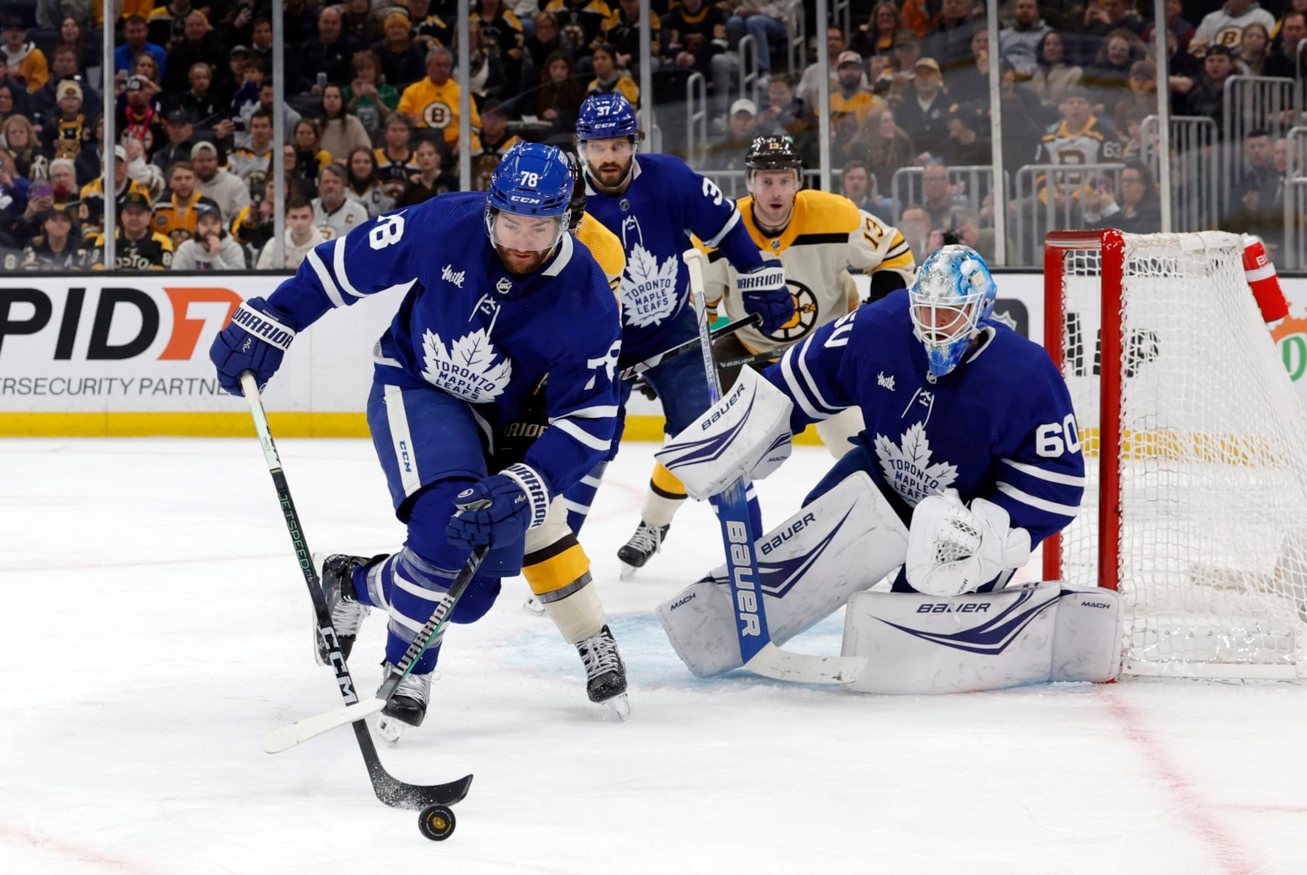 BOSTON, MA - MARCH 07: Toronto Maple Leafs defenseman T.J. Brodie (78) picks up the puck during a game between the Boston Bruins and the Toronto Maple Leafs on March 7, 2024, at TD Garden in Boston, Massachusetts. (Photo by Fred Kfoury III/Icon Sportswire via Getty Images)