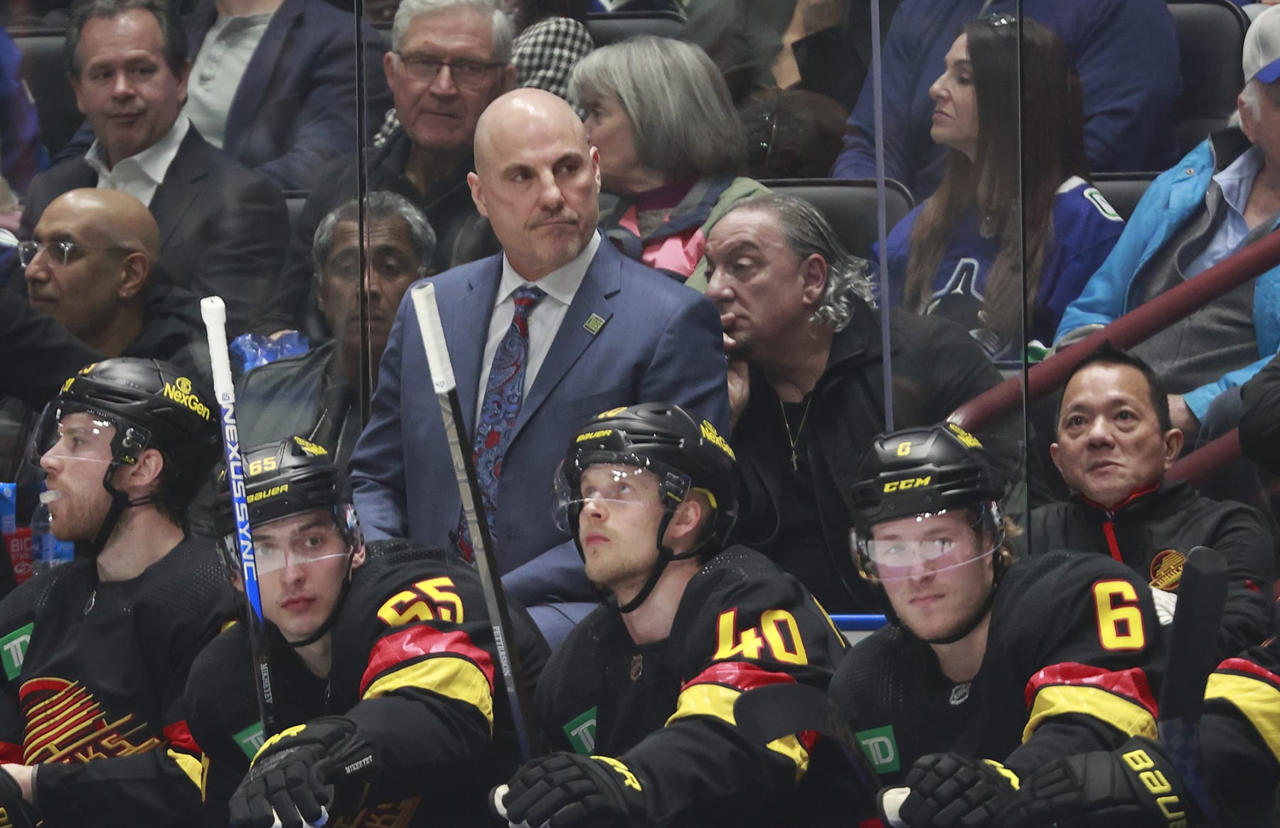 VANCOUVER, CANADA - APRIL 10: Head coach Rick Tocchet of the Vancouver Canucks looks on from the bench during their NHL game against the Arizona Coyotes at Rogers Arena on April 10, 2024 in Vancouver, British Columbia, Canada.  (Photo by Jeff Vinnick/NHLI via Getty Images)