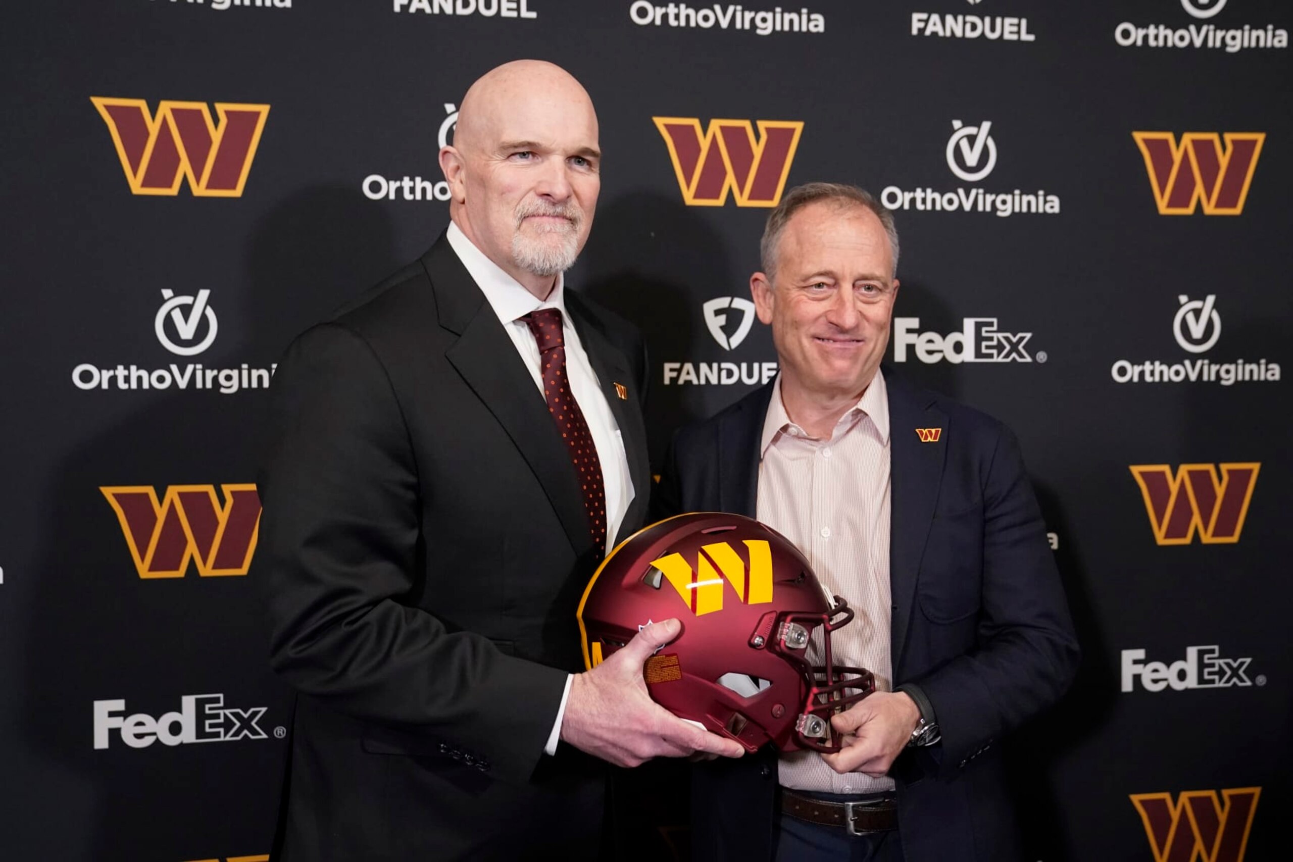 ASHBURN, VIRGINIA - FEBRUARY 05: Head coach Dan Quinn of the Washington Commanders poses for a photo with managing partner Josh Harris following a press conference at OrthoVirginia Training Center at Commanders Park on February 05, 2024 in Ashburn, Virginia. (Photo by Jess Rapfogel/Getty Images) ASHBURN, VIRGINIA - FEBRUARY 05: Head coach Dan Quinn of the Washington Commanders poses for a photo with managing partner Josh Harris following a press conference at OrthoVirginia Training Center at Commanders Park on February 05, 2024 in Ashburn, Virginia. (Photo by Jess Rapfogel/Getty Images)