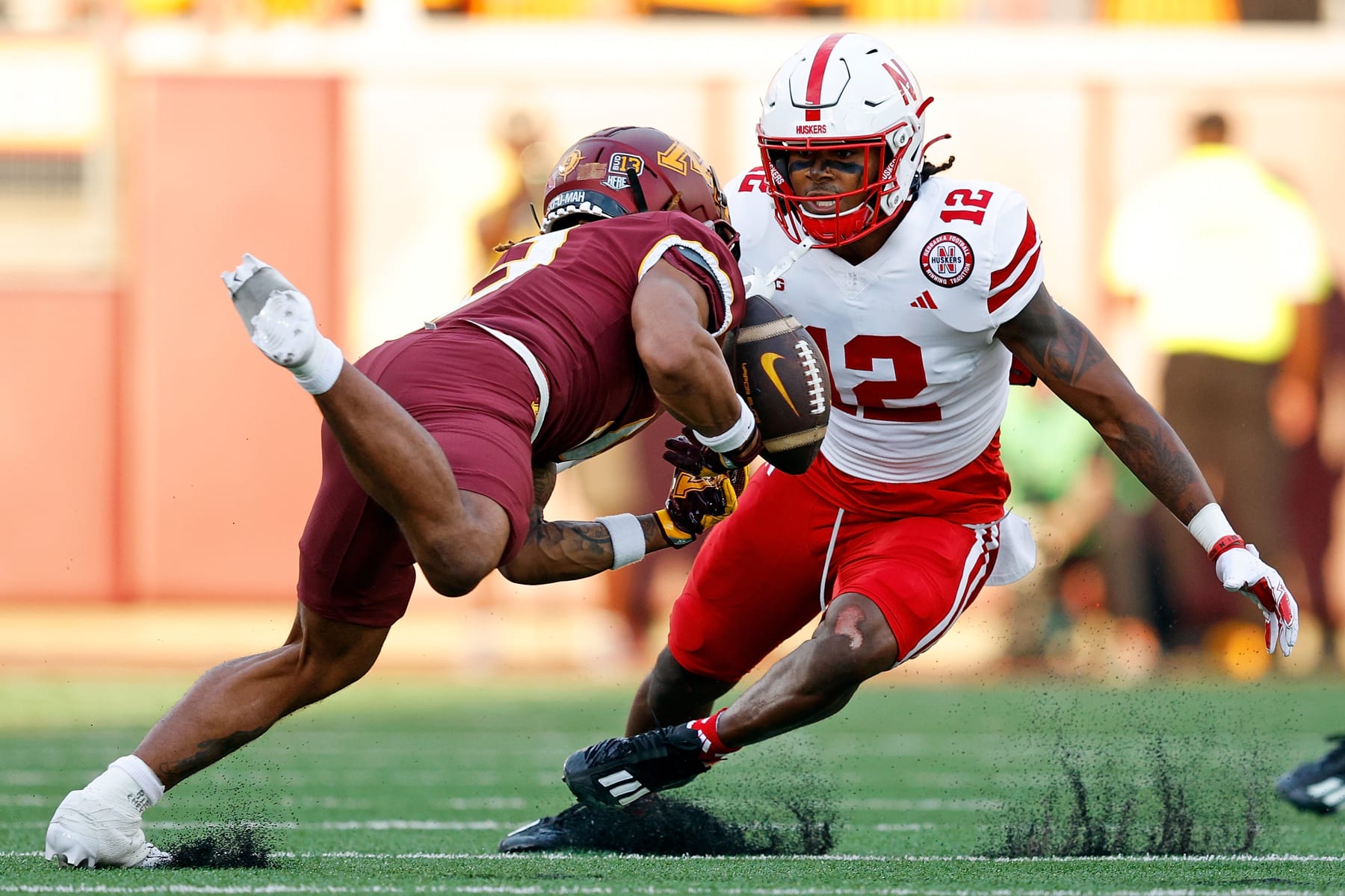 MINNEAPOLIS, MINNESOTA - AUGUST 31: Daniel Jackson #9 of the Minnesota Golden Gophers reaches for but can't catch a pass as Omar Brown #12 of the Nebraska Cornhuskers defends in the first half at Huntington Bank Stadium on August 31, 2023 in Minneapolis, Minnesota. (Photo by David Berding/Getty Images)