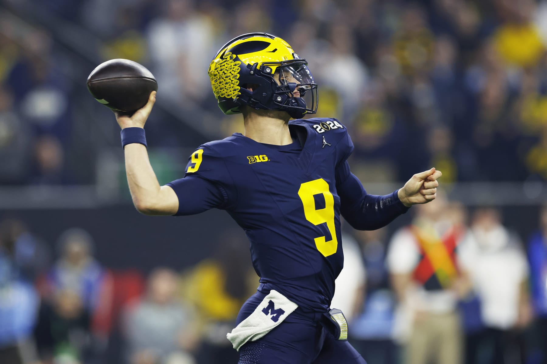 HOUSTON, TX - JANUARY 08: Michigan Wolverines quarterback J.J. McCarthy (9) passes the ball during the CFP National Championship against the Washington Huskies on January 08, 2024 at NRG Stadium in Houston, Texas. (Photo by Joe Robbins/Icon Sportswire via Getty Images)