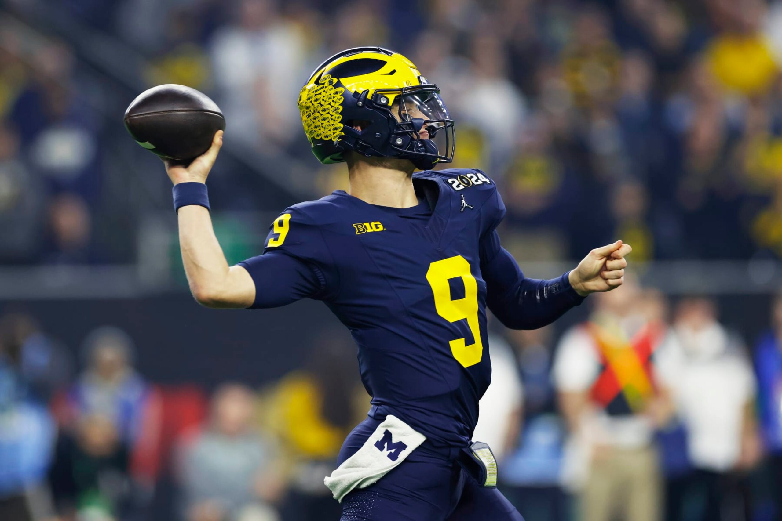 HOUSTON, TX - JANUARY 08: Michigan Wolverines quarterback J.J. McCarthy (9) passes the ball during the CFP National Championship against the Washington Huskies on January 08, 2024 at NRG Stadium in Houston, Texas. (Photo by Joe Robbins/Icon Sportswire via Getty Images)