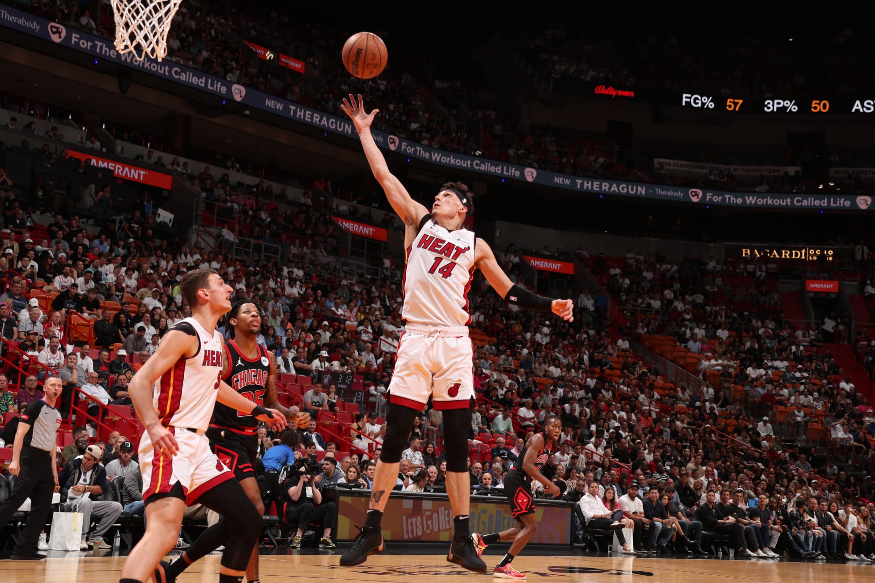MIAMI, FL - APRIL 19: Tyler Herro #14 of the Miami Heat grabs the rebound during the game against the Chicago Bulls during the 2024 Play-In Tournament on April 19, 2024 at Kaseya Center in Miami, Florida. NOTE TO USER: User expressly acknowledges and agrees that, by downloading and or using this Photograph, user is consenting to the terms and conditions of the Getty Images License Agreement. Mandatory Copyright Notice: Copyright 2024 NBAE (Photo by Issac Baldizon/NBAE via Getty Images)