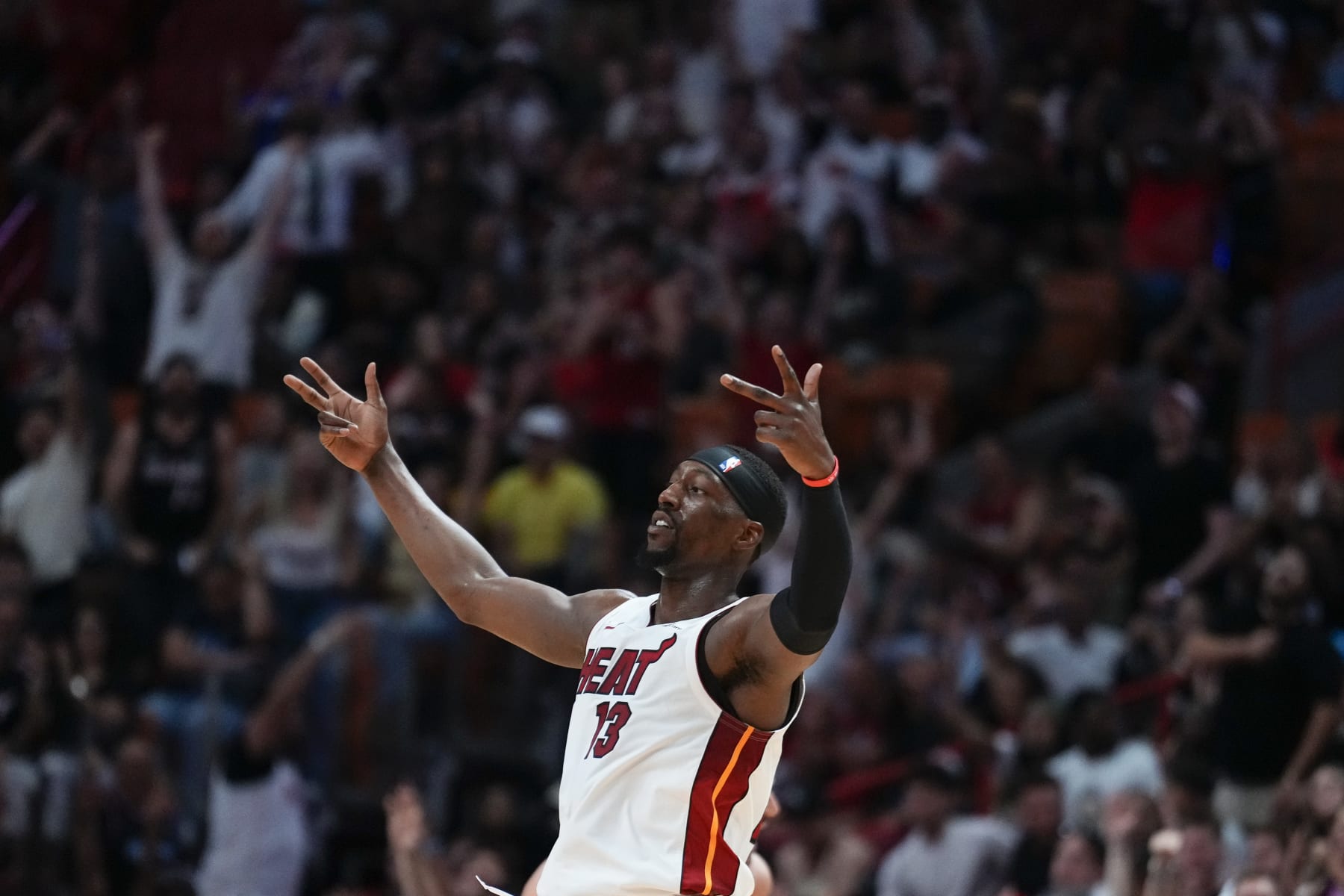 MIAMI, FLORIDA - APRIL 19: Bam Adebayo #13 of the Miami Heat celebrates scoring a three-pointer against the Chicago Bulls in the third quarter during the Play-In Tournament at Kaseya Center on April 19, 2024 in Miami, Florida. NOTE TO USER: User expressly acknowledges and agrees that, by downloading and or using this photograph, User is consenting to the terms and conditions of the Getty Images License Agreement. (Photo by Rich Storry/Getty Images)