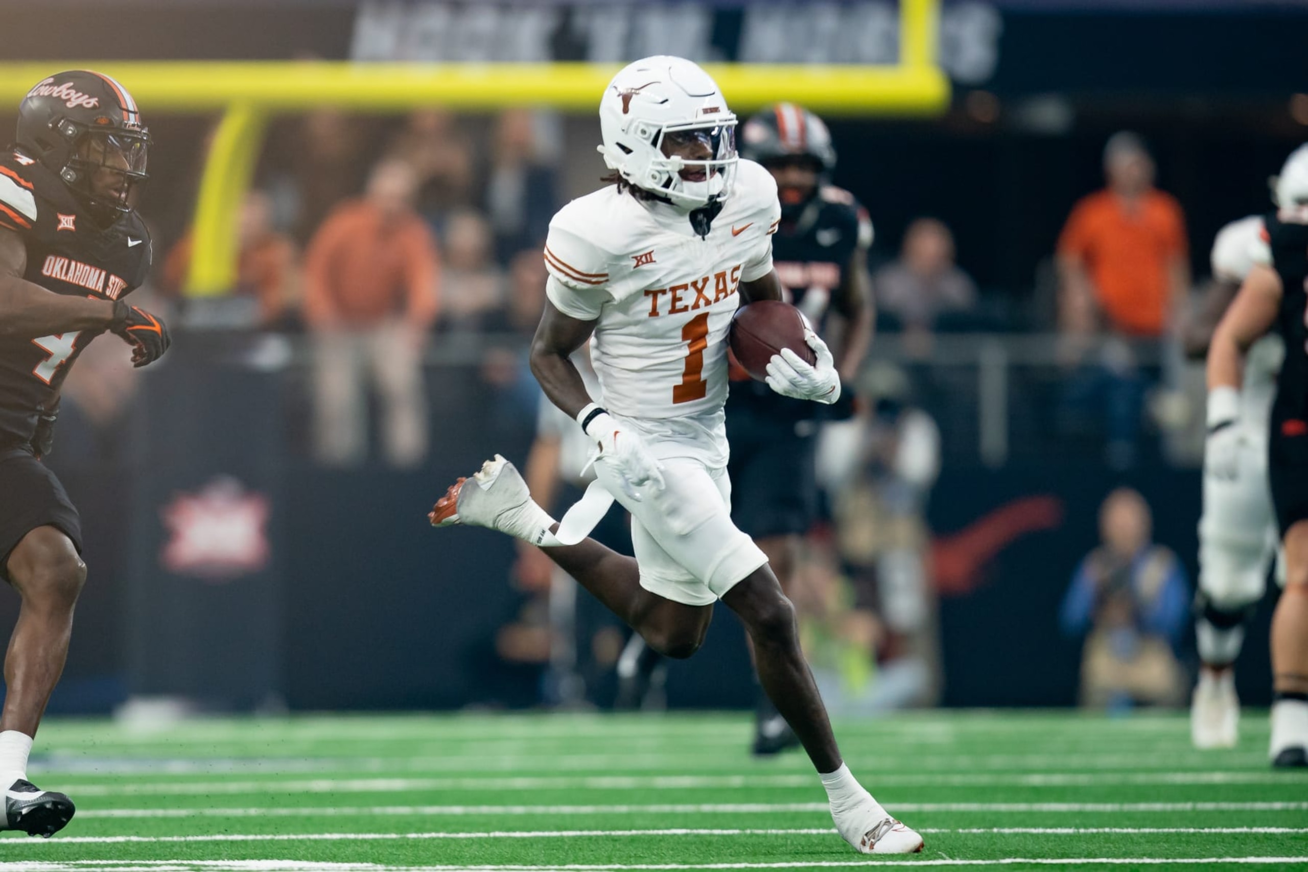 ARLINGTON, TX - DECEMBER 02: Texas Longhorns wide receiver Xavier Worthy (1) runs after the catch during the Big 12 Championship game between the Texas Longhorns and the Oklahoma State Cowboys   on December 02, 2023 at AT&T Stadium in Arlington, TX. (Photo by Chris Leduc/Icon Sportswire via Getty Images)