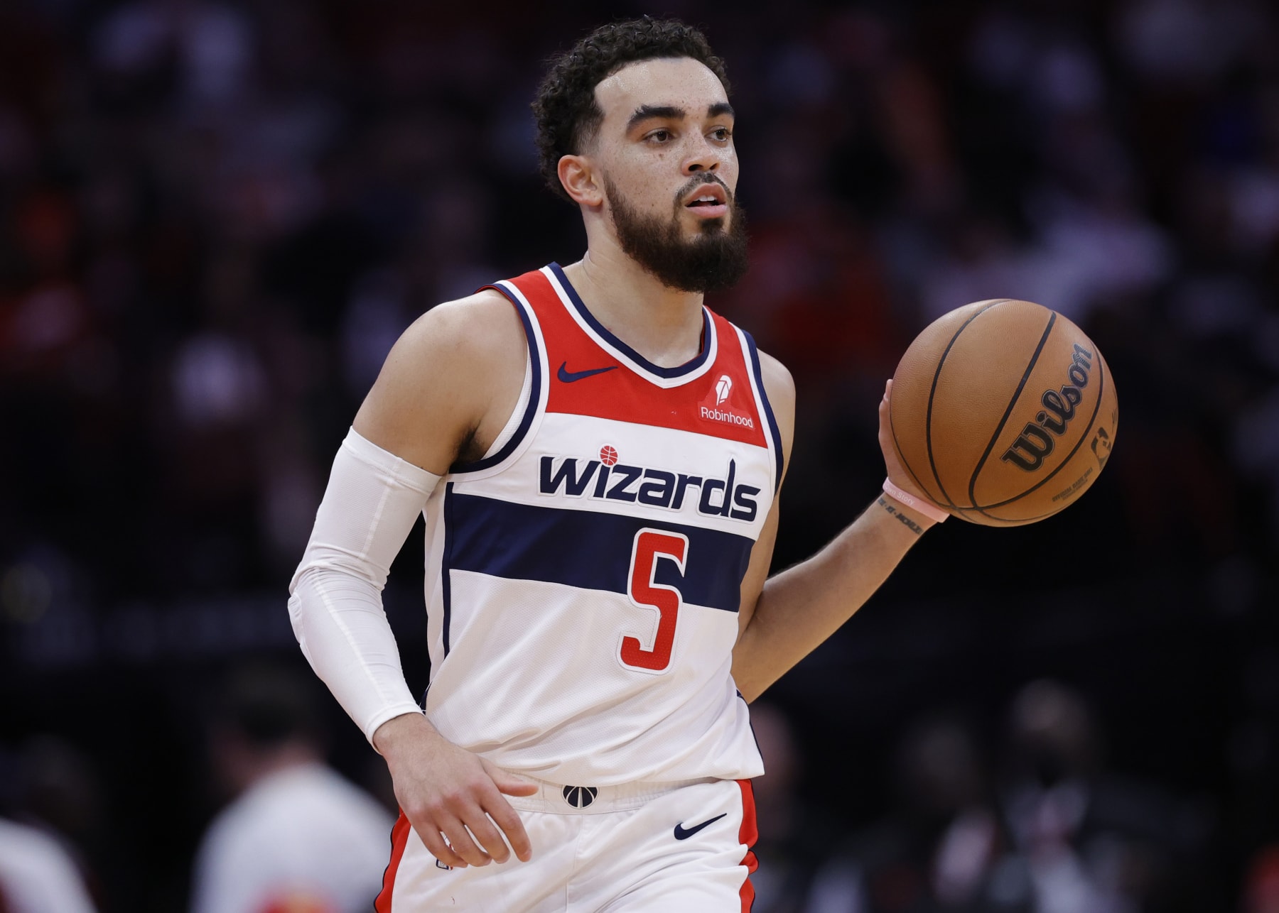 HOUSTON, TEXAS - MARCH 14: Tyus Jones #5 of the Washington Wizards in action against the Houston Rockets during the first half at Toyota Center on March 14, 2024 in Houston, Texas. NOTE TO USER: User expressly acknowledges and agrees that, by downloading and or using this photograph, User is consenting to the terms and conditions of the Getty Images License Agreement.  (Photo by Carmen Mandato/Getty Images)