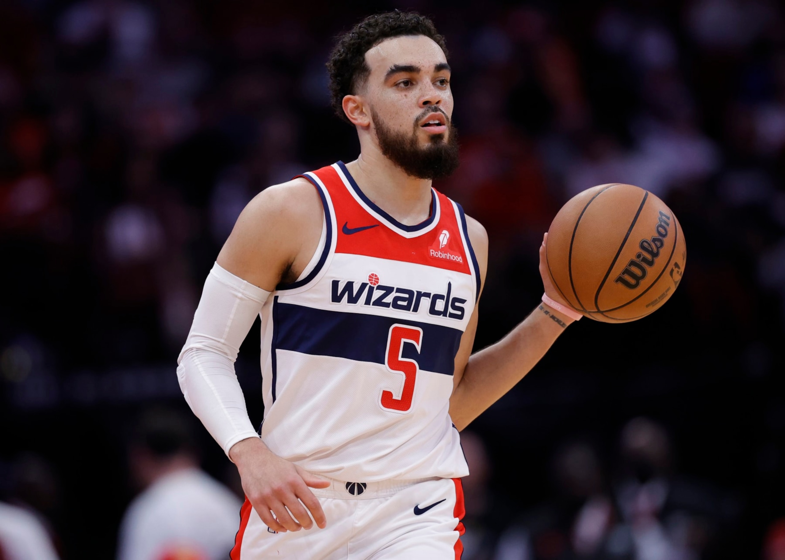 HOUSTON, TEXAS - MARCH 14: Tyus Jones #5 of the Washington Wizards in action against the Houston Rockets during the first half at Toyota Center on March 14, 2024 in Houston, Texas. NOTE TO USER: User expressly acknowledges and agrees that, by downloading and or using this photograph, User is consenting to the terms and conditions of the Getty Images License Agreement.  (Photo by Carmen Mandato/Getty Images)