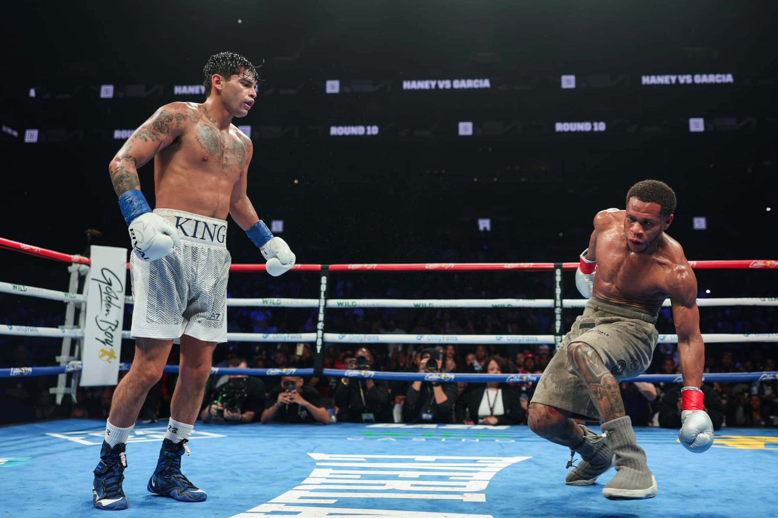 NEW YORK, NEW YORK - APRIL 20: Ryan Garcia knocks down Devin Haney during a fight at Barclays Center on April 20, 2024 in New York City.  (Photo by Cris Esqueda/Golden Boy/Getty Images)
