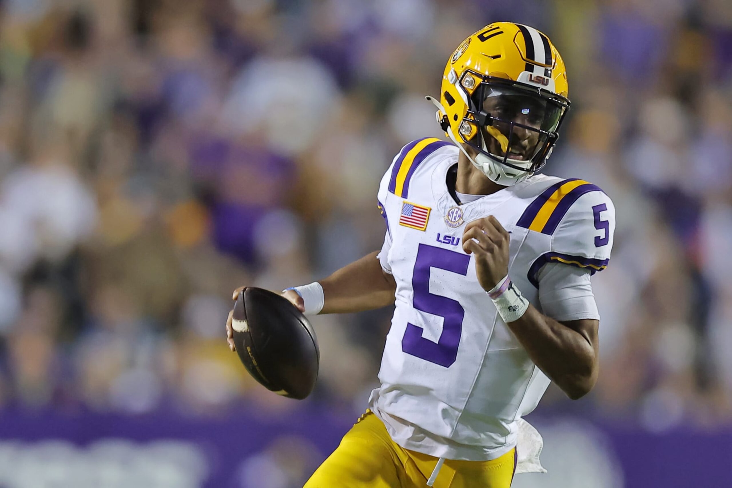 BATON ROUGE, LOUISIANA - NOVEMBER 11: Jayden Daniels #5 of the LSU Tigers runs with the ball against the Florida Gators during a game at Tiger Stadium on November 11, 2023 in Baton Rouge, Louisiana. (Photo by Jonathan Bachman/Getty Images)
