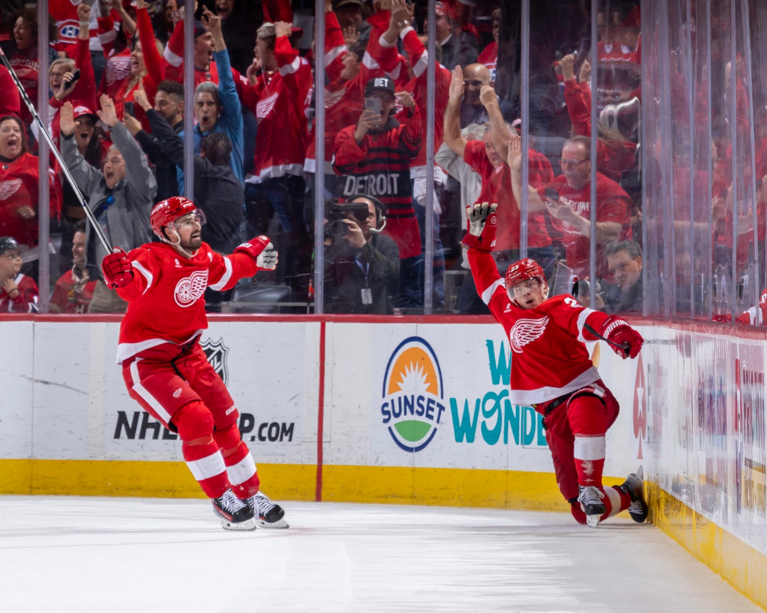 DETROIT, MI - APRIL 15: Lucas Raymond #23 of the Detroit Red Wings scores the game winning gaol on Sam Montembeault #35 of the Montreal Canadiens during the O.T. period at Little Caesars Arena on April 15, 2024 in Detroit, Michigan. Detroit defeated Montreal in O.T. 5-4. (Photo by Dave Reginek/NHLI via Getty Images)