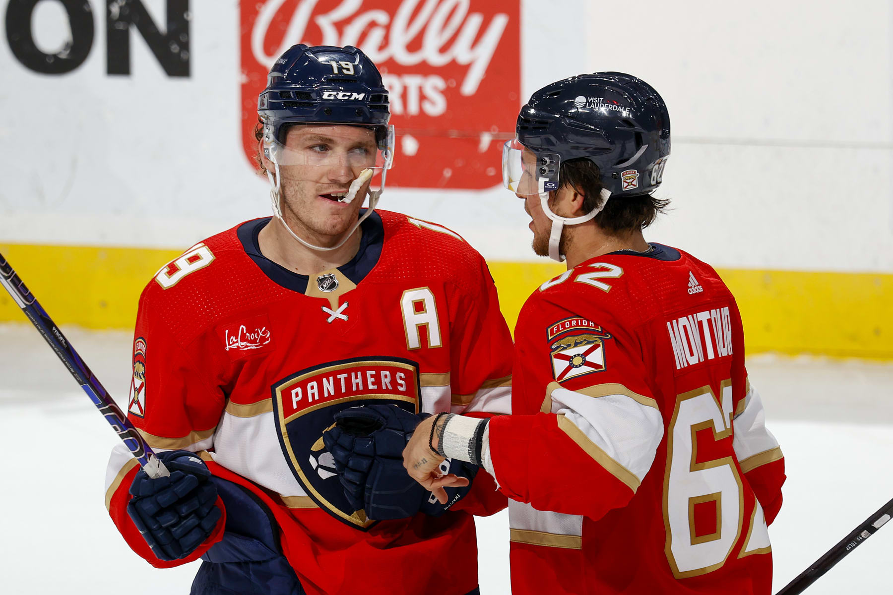 SUNRISE, FL - APRIL 13: Brandon Montour #62 and  Matthew Tkachuk #19 of the Florida Panthers talk during a break in action against the Buffalo Sabres at the Amerant Bank Arena on April 13, 2024 in Sunrise, Florida. (Photo by Joel Auerbach/Getty Images)