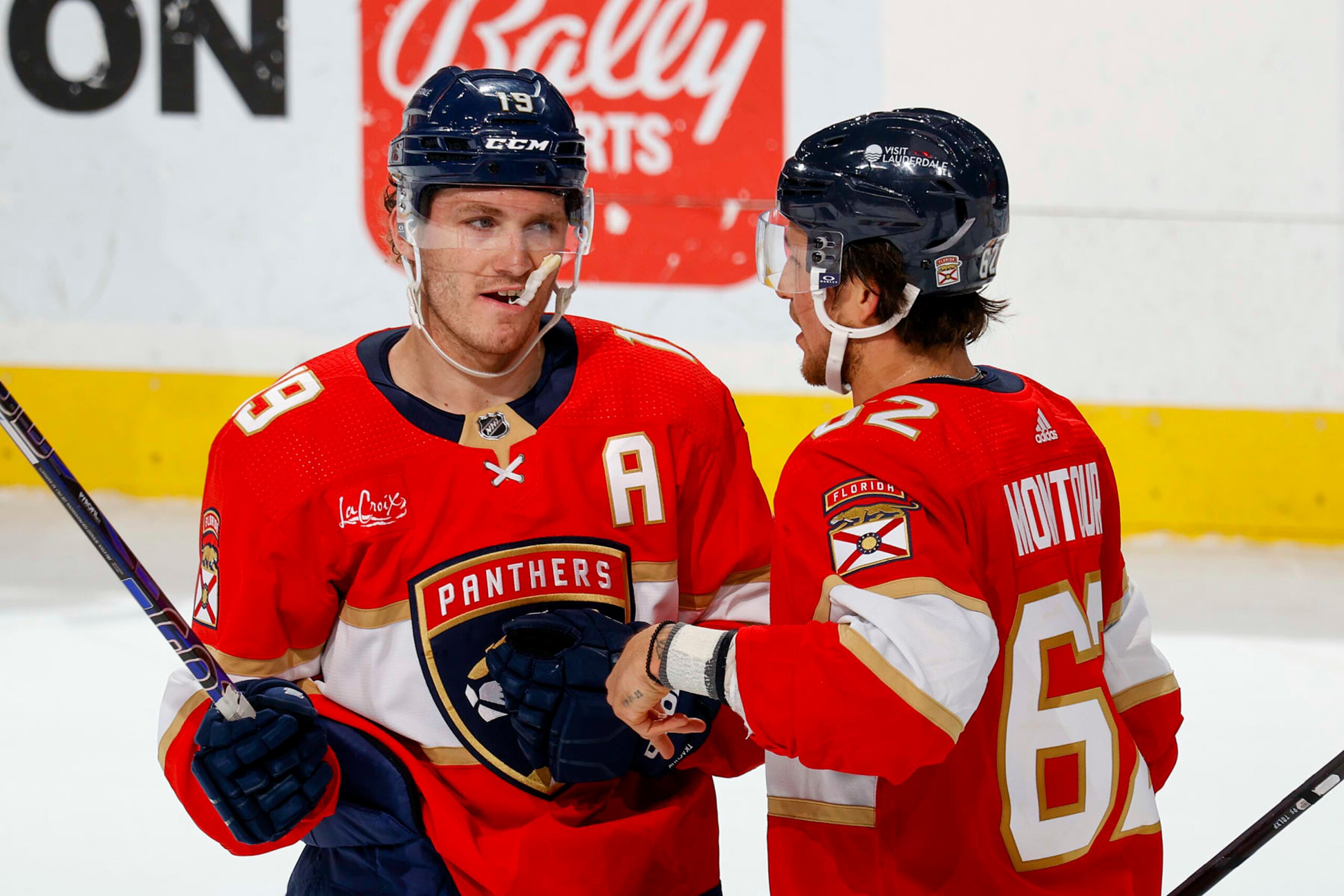 SUNRISE, FL - APRIL 13: Brandon Montour #62 and  Matthew Tkachuk #19 of the Florida Panthers talk during a break in action against the Buffalo Sabres at the Amerant Bank Arena on April 13, 2024 in Sunrise, Florida. (Photo by Joel Auerbach/Getty Images)