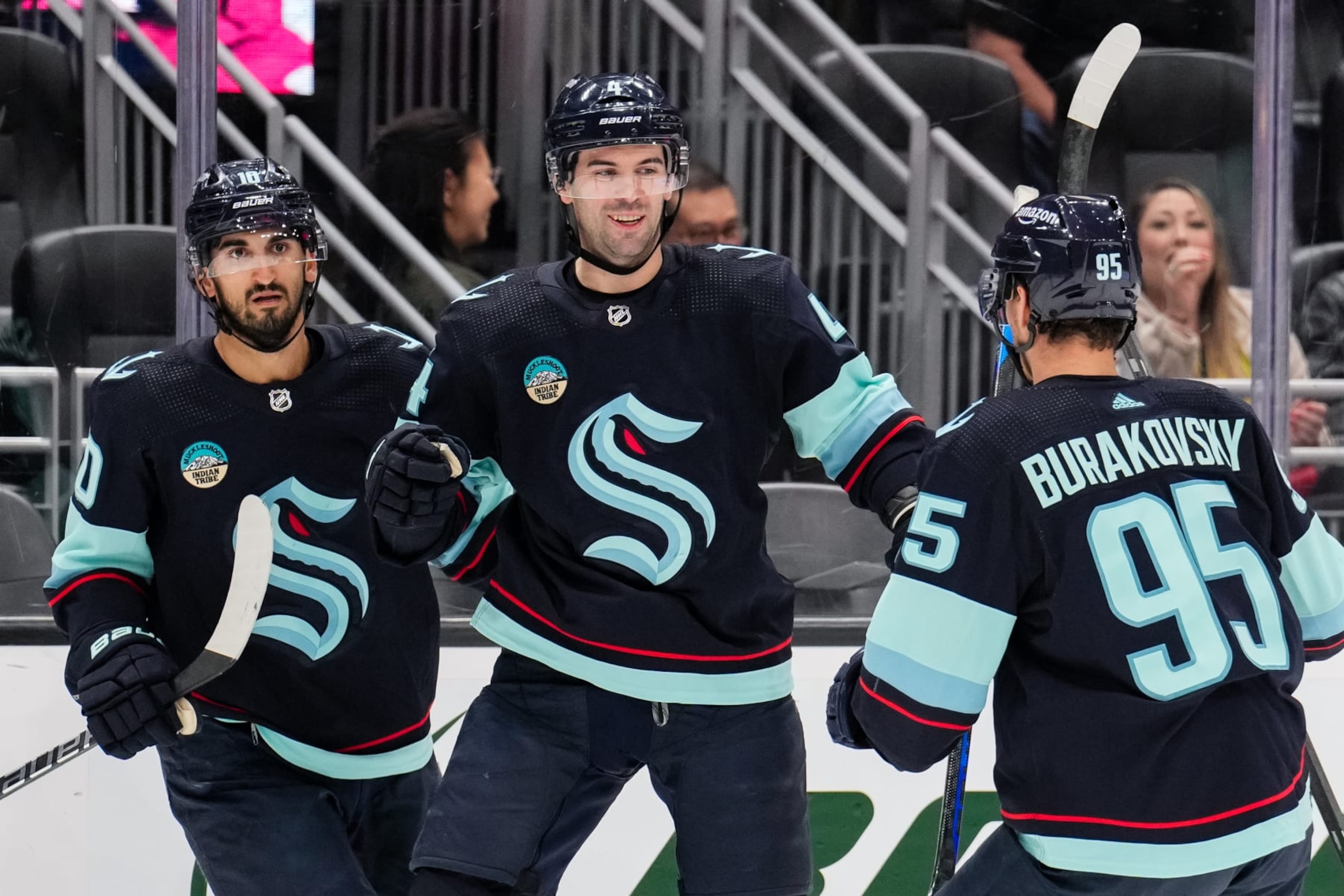 SEATTLE, WASHINGTON - APRIL 09: Justin Schultz #4 of the Seattle Kraken celebrates with teammates after scoring a goal during the first period of a game against the Arizona Coyotes at Climate Pledge Arena on April 9, 2024 in Seattle, Washington. (Photo by Christopher Mast/NHLI via Getty Images)